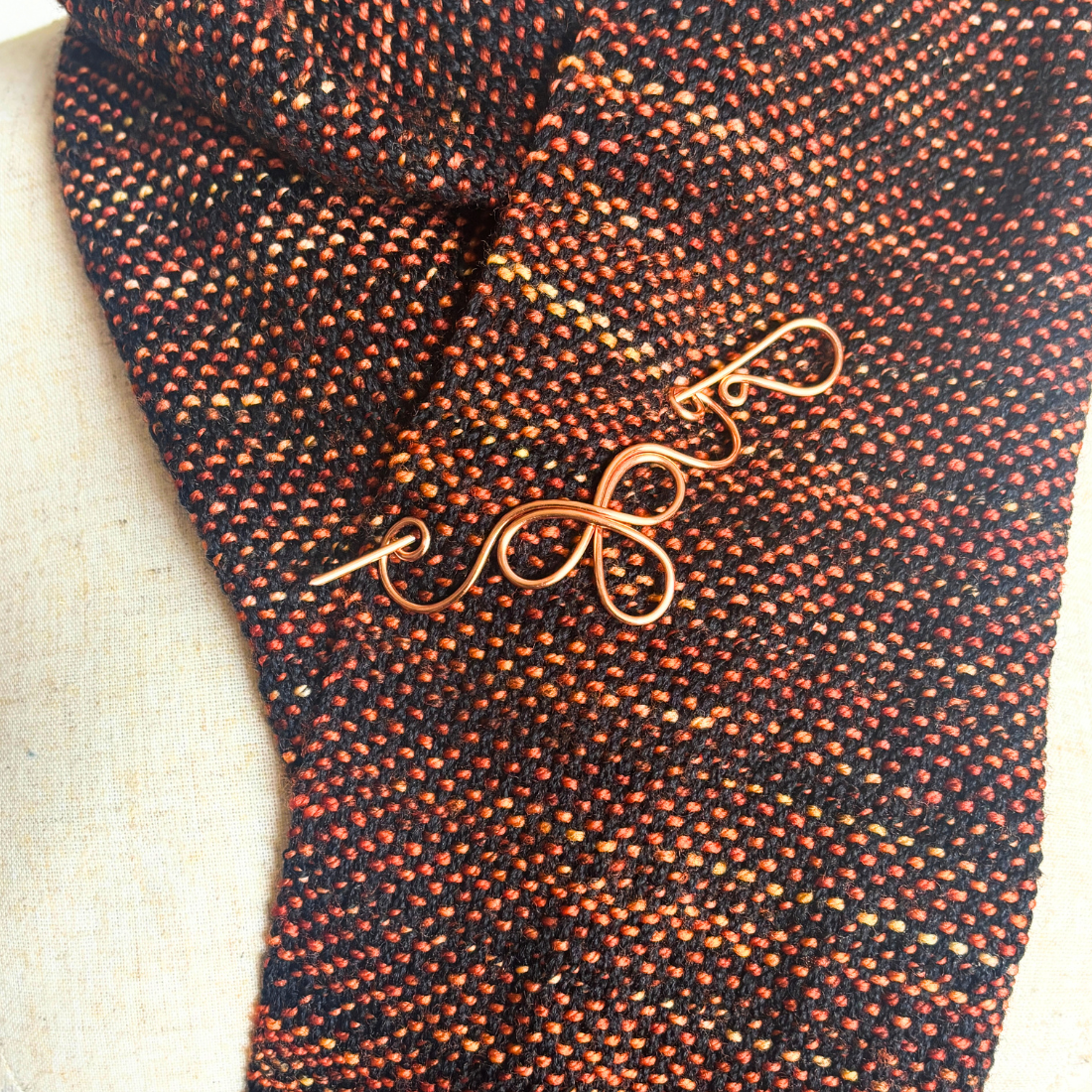 Celtic shawl pin on scarf.png