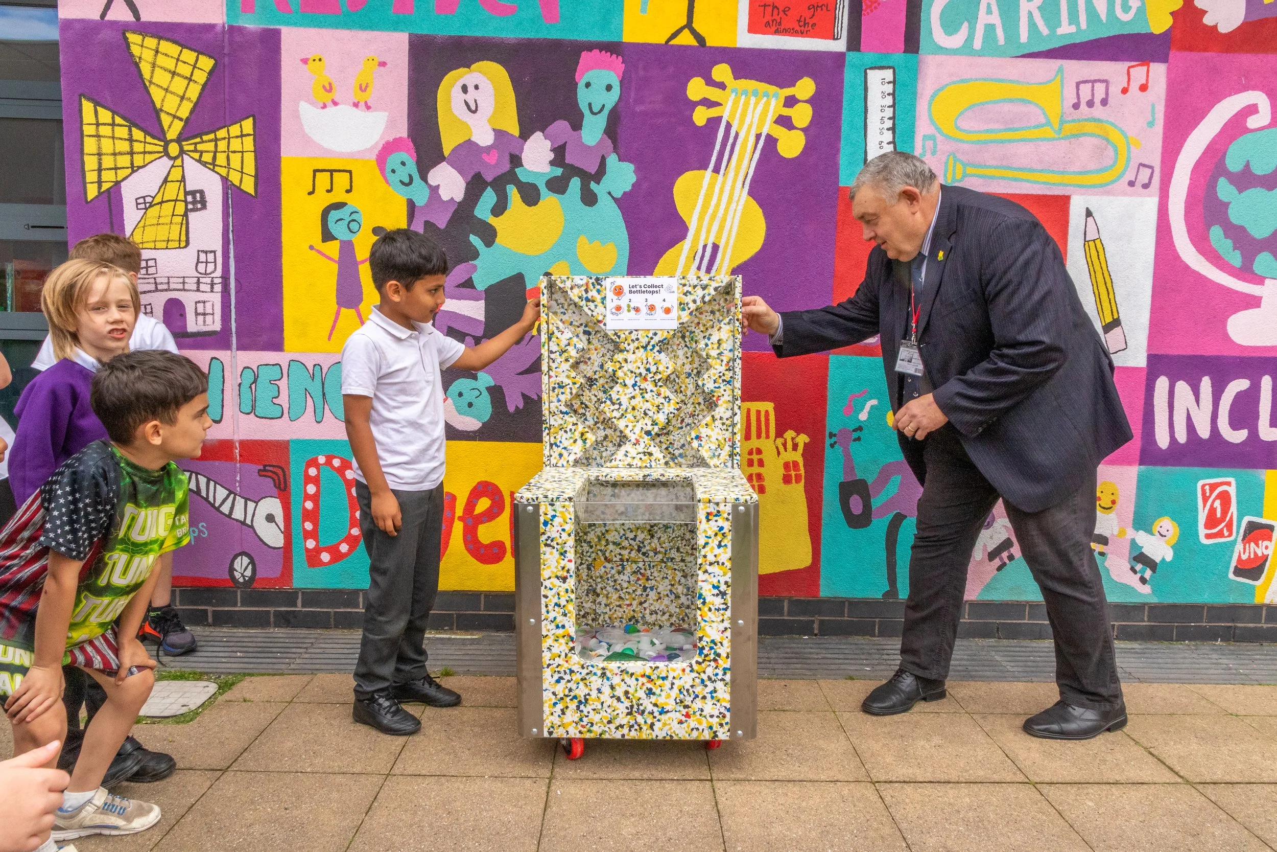 Pupils collecting bottle tops for Plastic Revolution