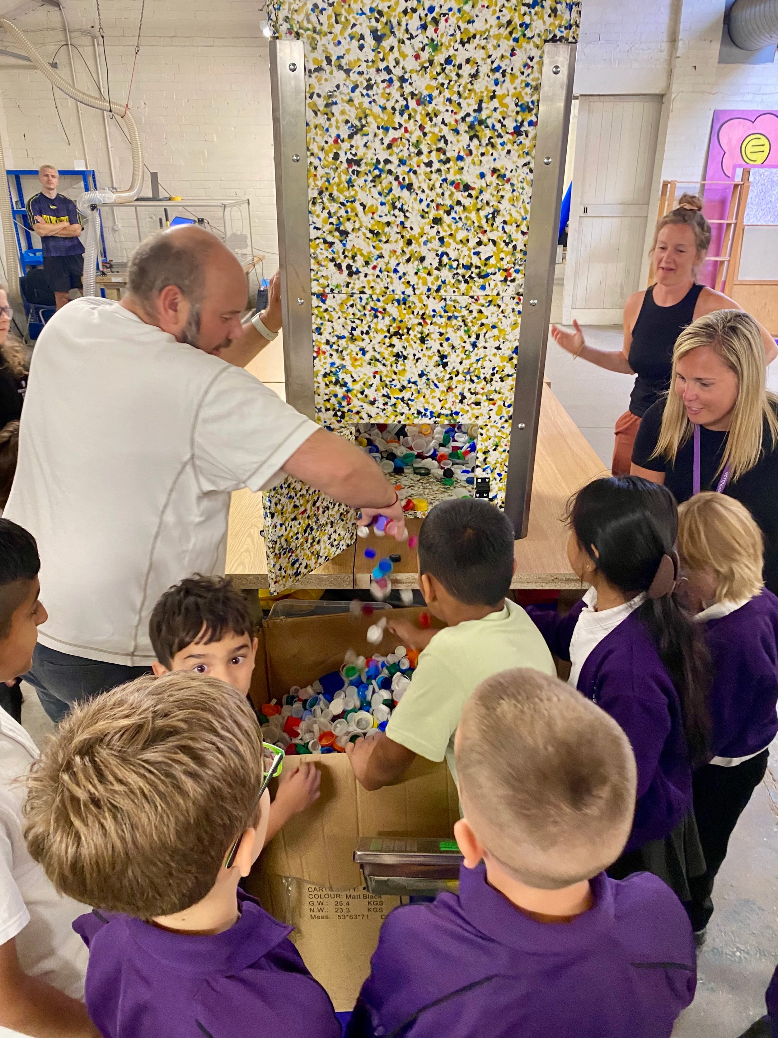 Eco Leaders emptying the bottle top collector