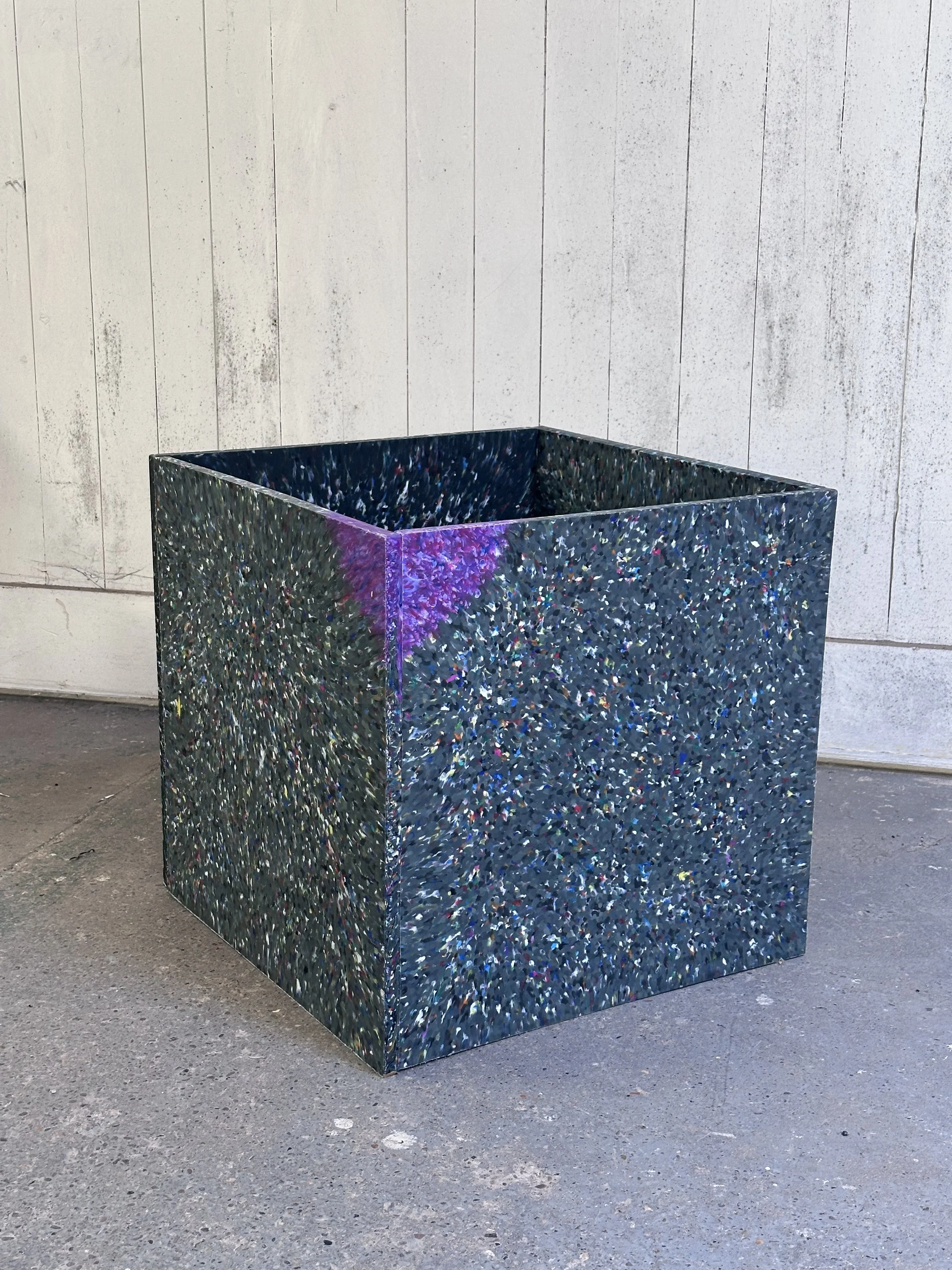 A planter assembled in Future Makers workshop with two purple corners