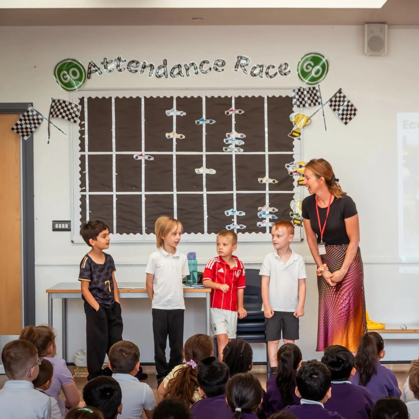 Eco Leaders standing at the front in celebration assembly 