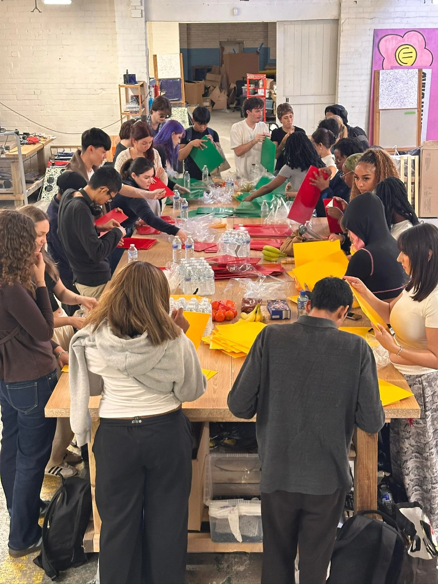 Architecture students peeling plastic off the High Impact Polystyrene