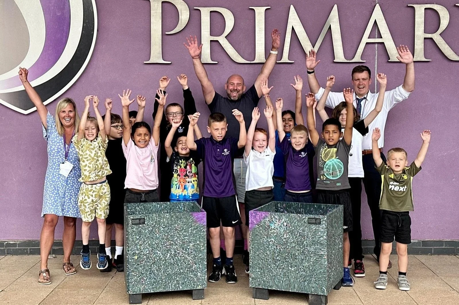 Eco Leaders with recycled plastic planters at Nottingham Primary Academy