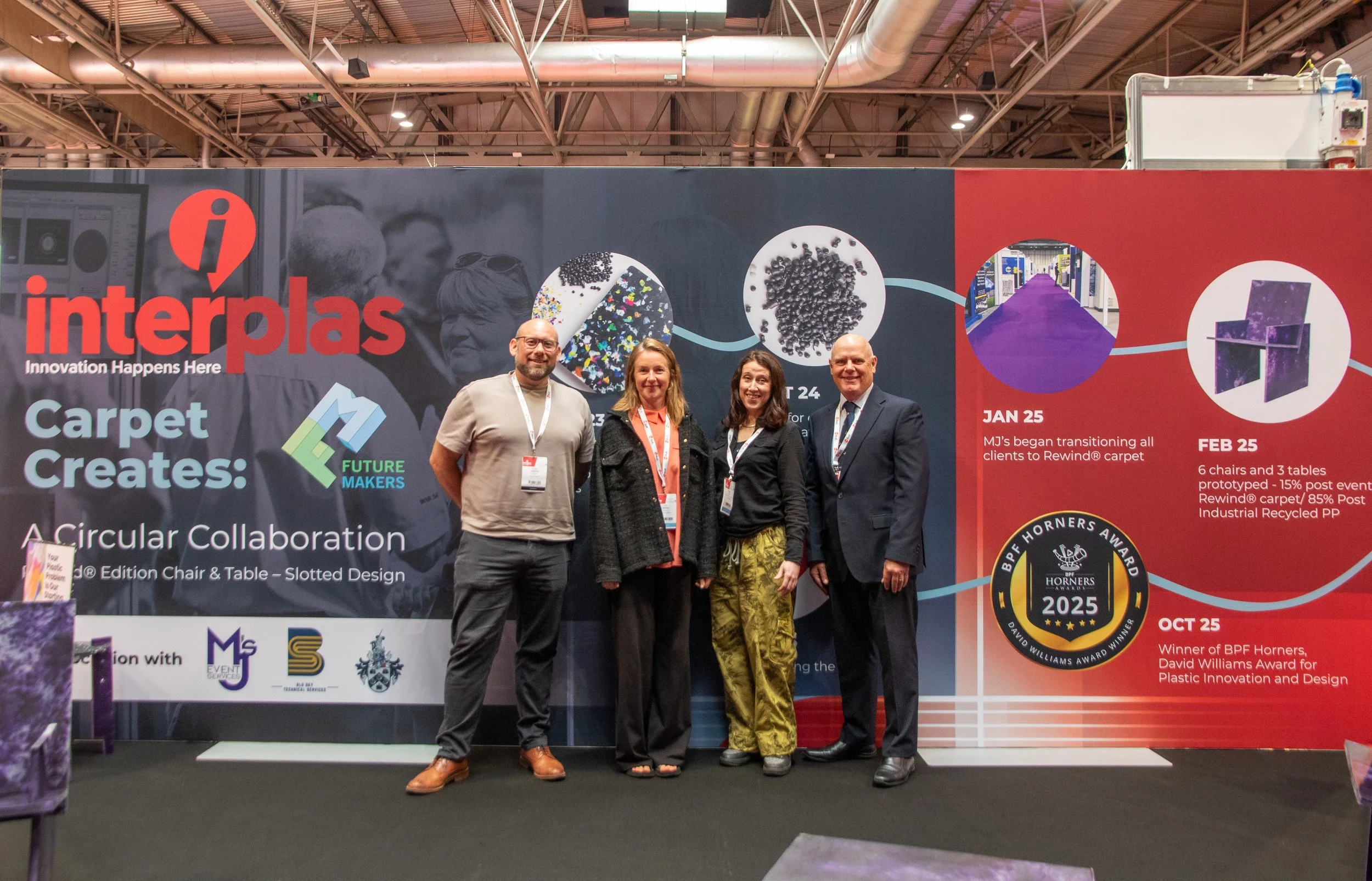Tristan Hessing, Gill Barker, Natalie Coe and Stefaan Simons standing in front of the Future Makers display showcasing Carpet Creates and the Plastic Revolution at Interplas 2026.