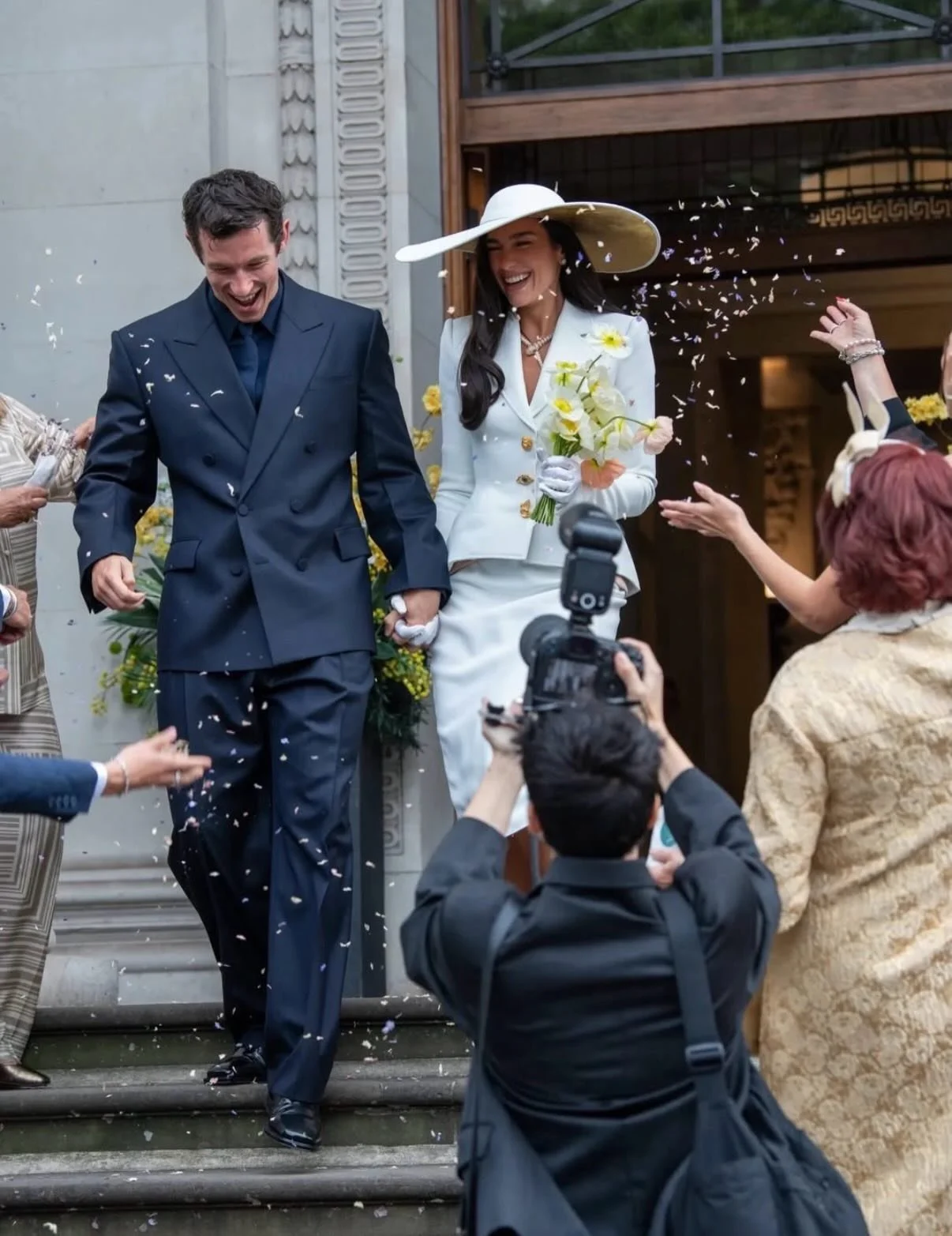 a wedding moment we are loving: Dua Lipa &amp; Callum Turner.

Gleaming after their civil ceremony at Old Marylebone Town Hall in London on Sunday, May 31, Dua&rsquo;s wearing a custom Schiaparelli by Daniel Roseberry ensemble, paired with a Stephen 