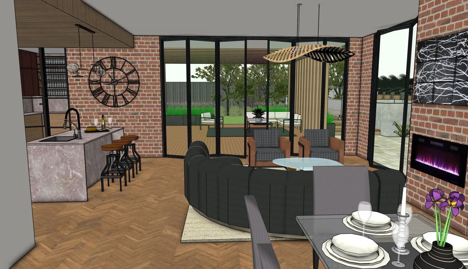 Modern living room with a brick wall, large glass doors leading outside to a patio and garden, a black curved sofa, two armchairs, a round glass coffee table, dining space, fireplace, and kitchen area with a stone island and barstools.