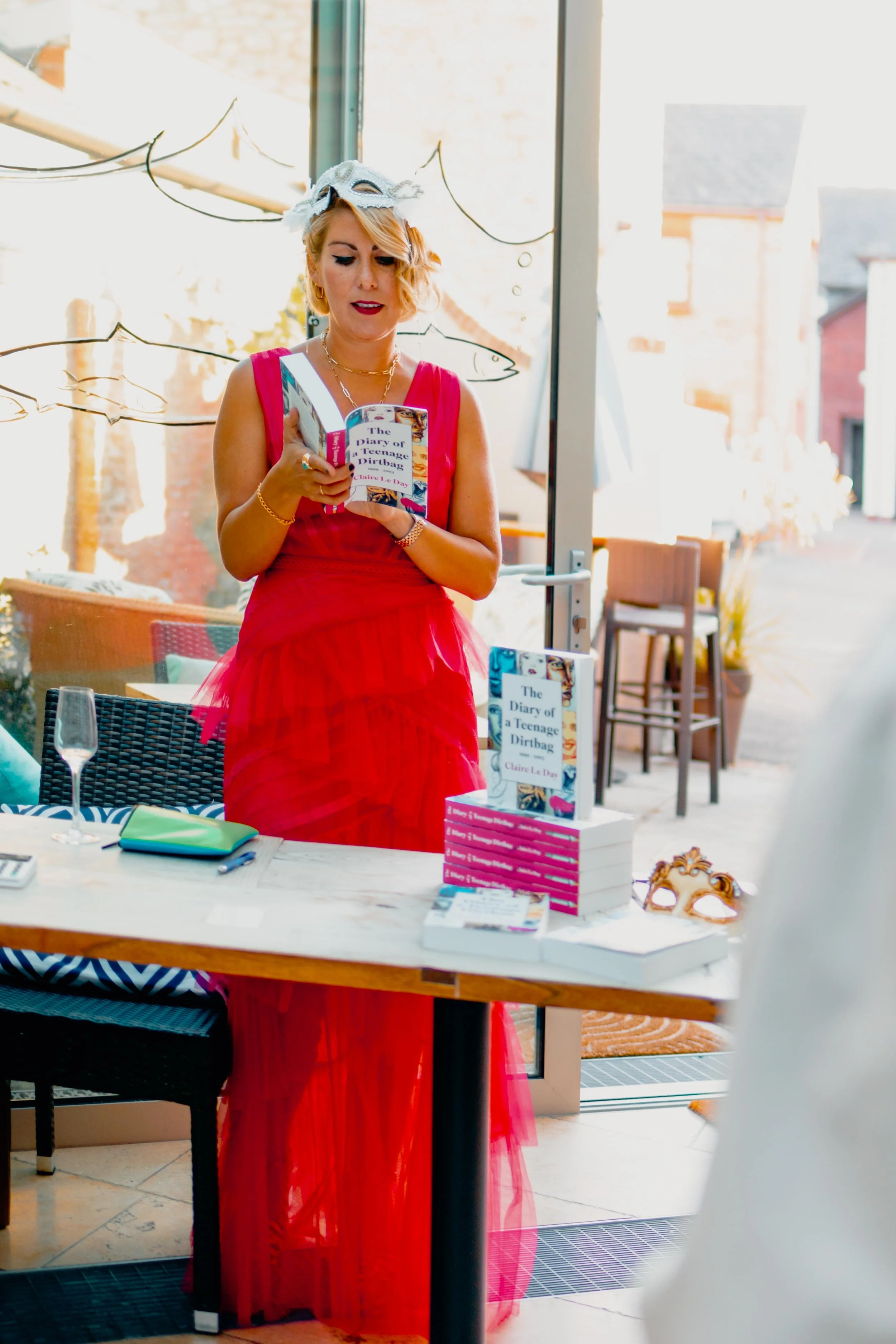 Claire reading an extract from her debut book, The Diary of a Teenage Dirtbag at her book launch at The Salutation Inn, in Topsham, Devon. 