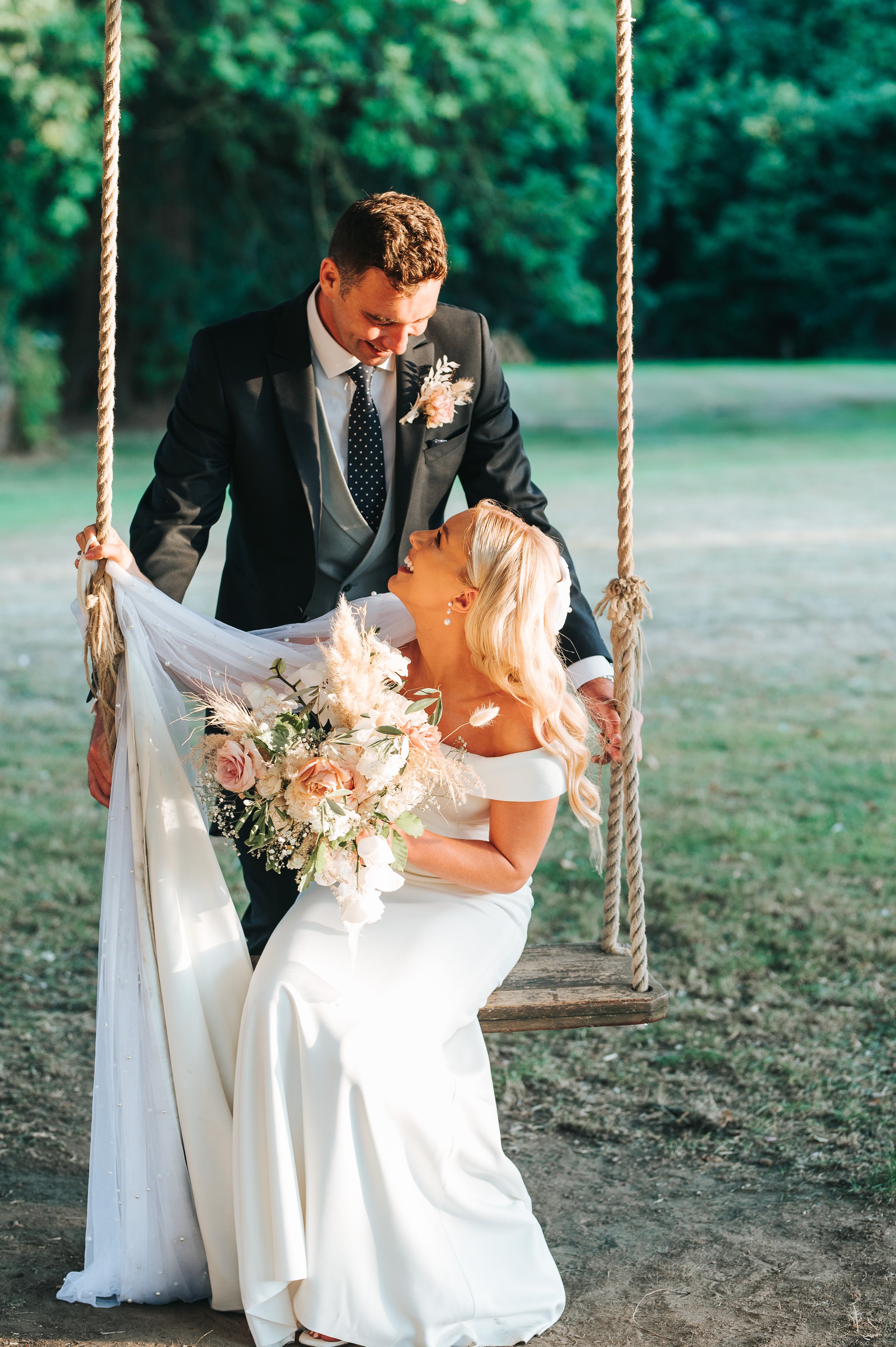 Wedding couple on a swing
