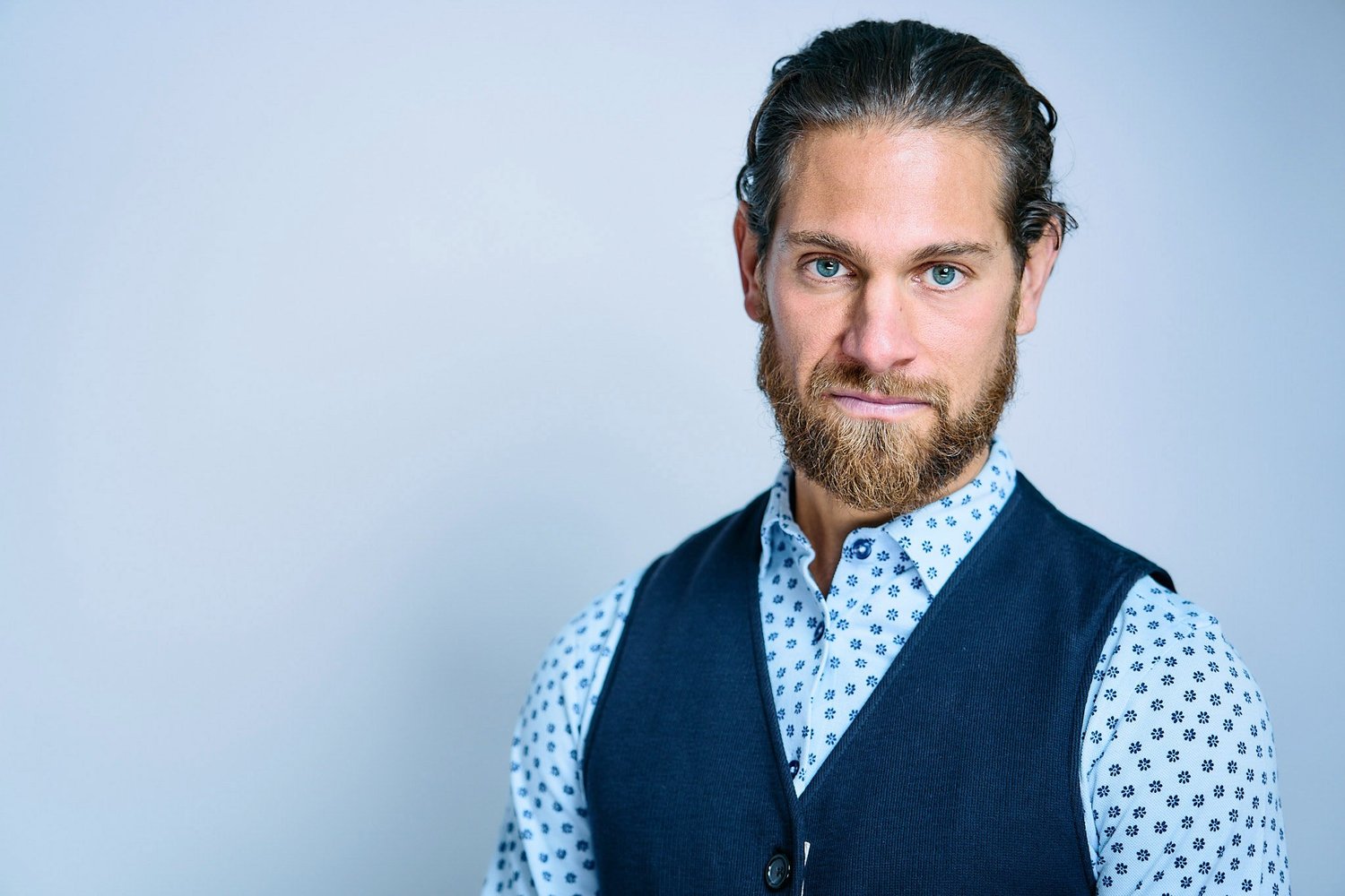 Benjamin Nathan Serio, benefit auctioneer, in a blue waistcoat