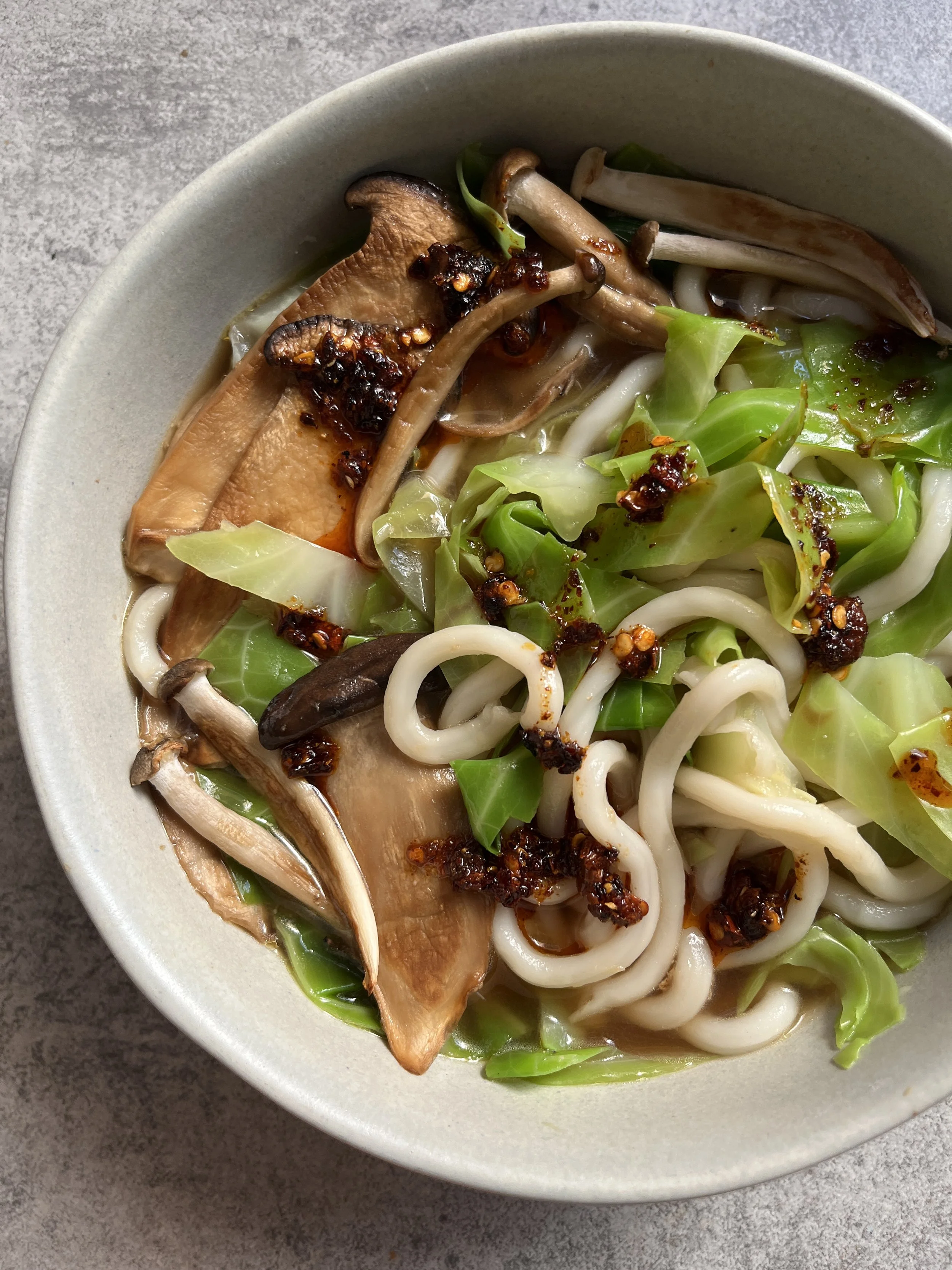 Udon noodle soup with cabbage and mushrooms