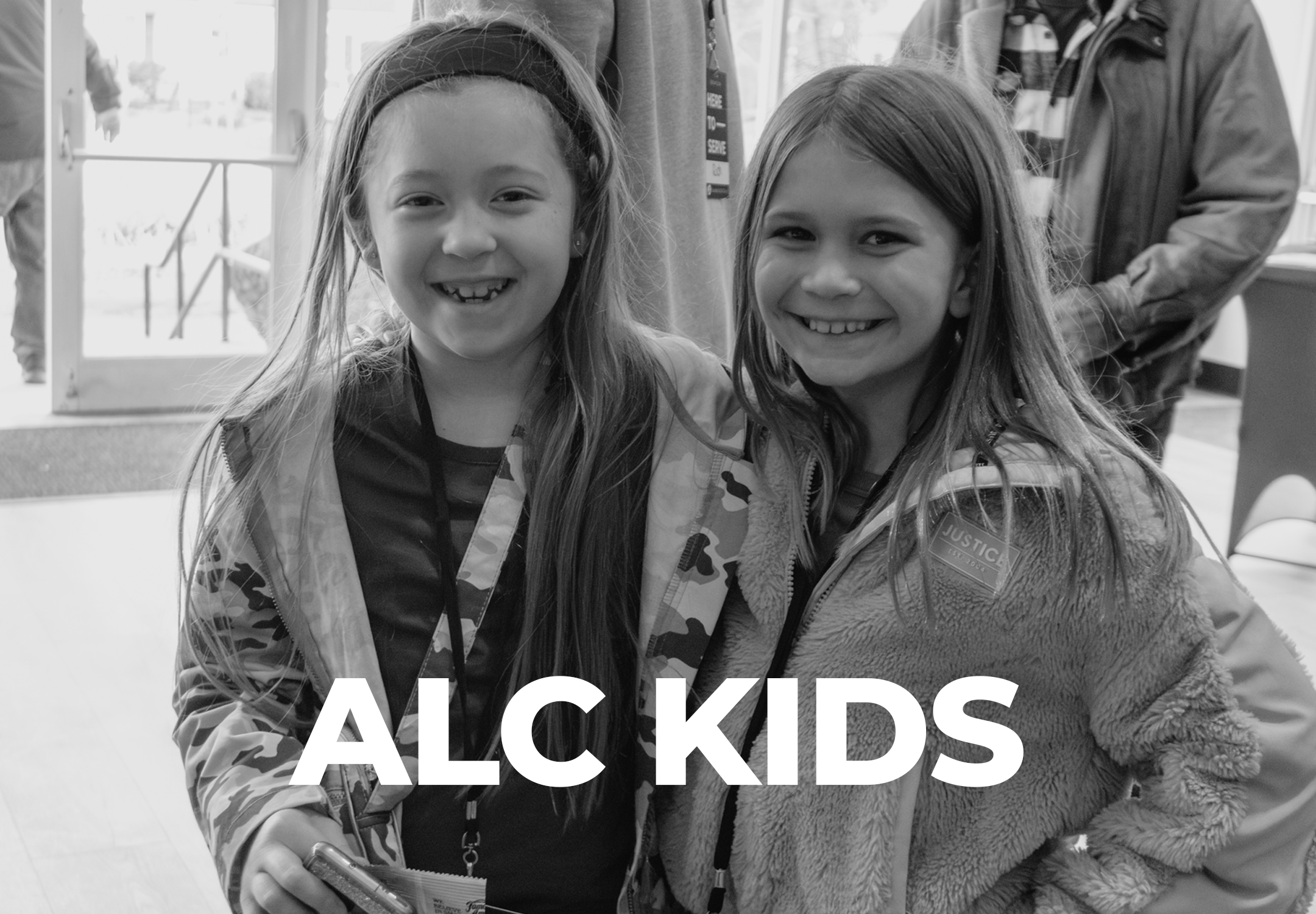 Children at ALC Kids ministry at Abundant Life Church in Wilmington, MA, with the ALC Kids logo.