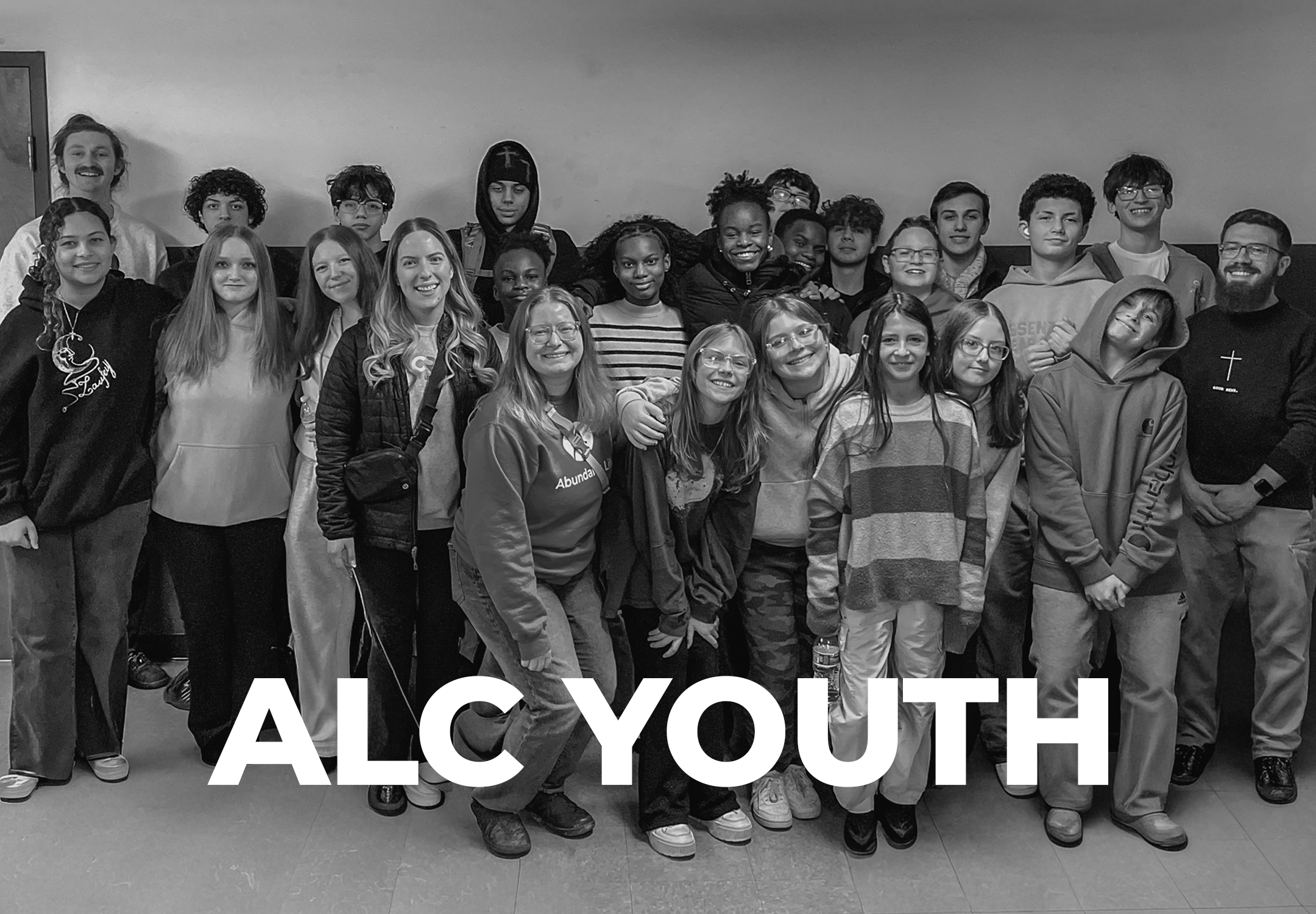 Teenagers at ALC Youth ministry at Abundant Life Church in Wilmington, MA, smiling together for a group photo.
