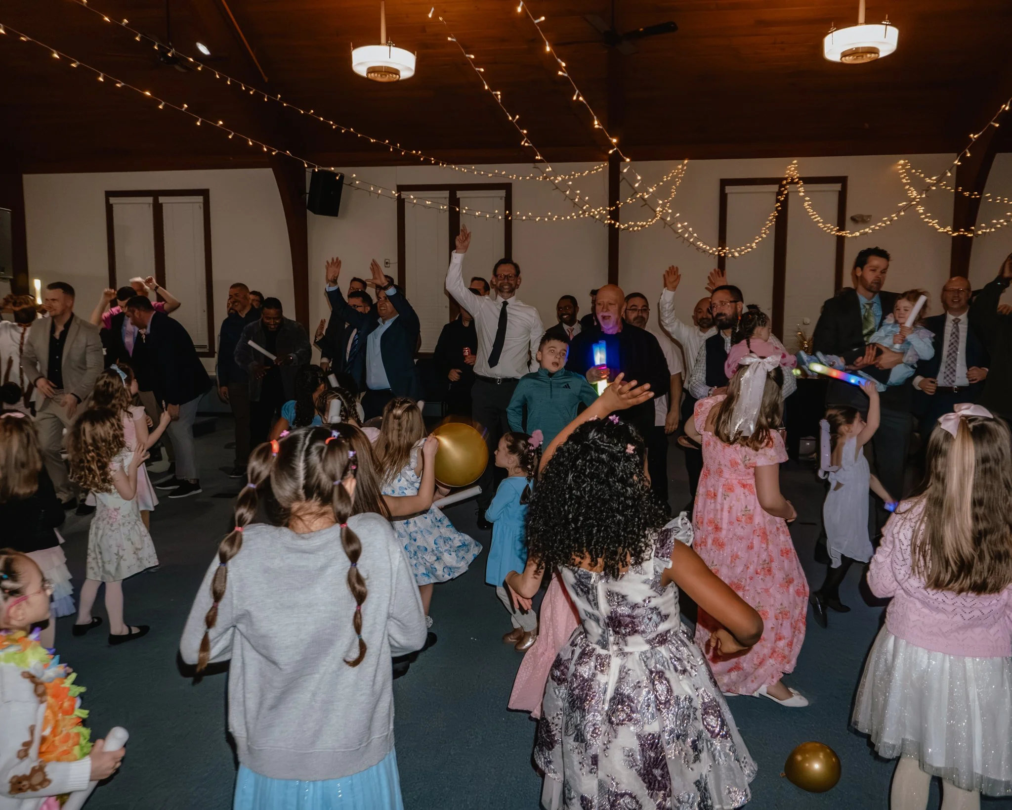 Fathers and daughters dancing together during the Daddy Daughter Dance at Abundant Life Church in Wilmington MA.
