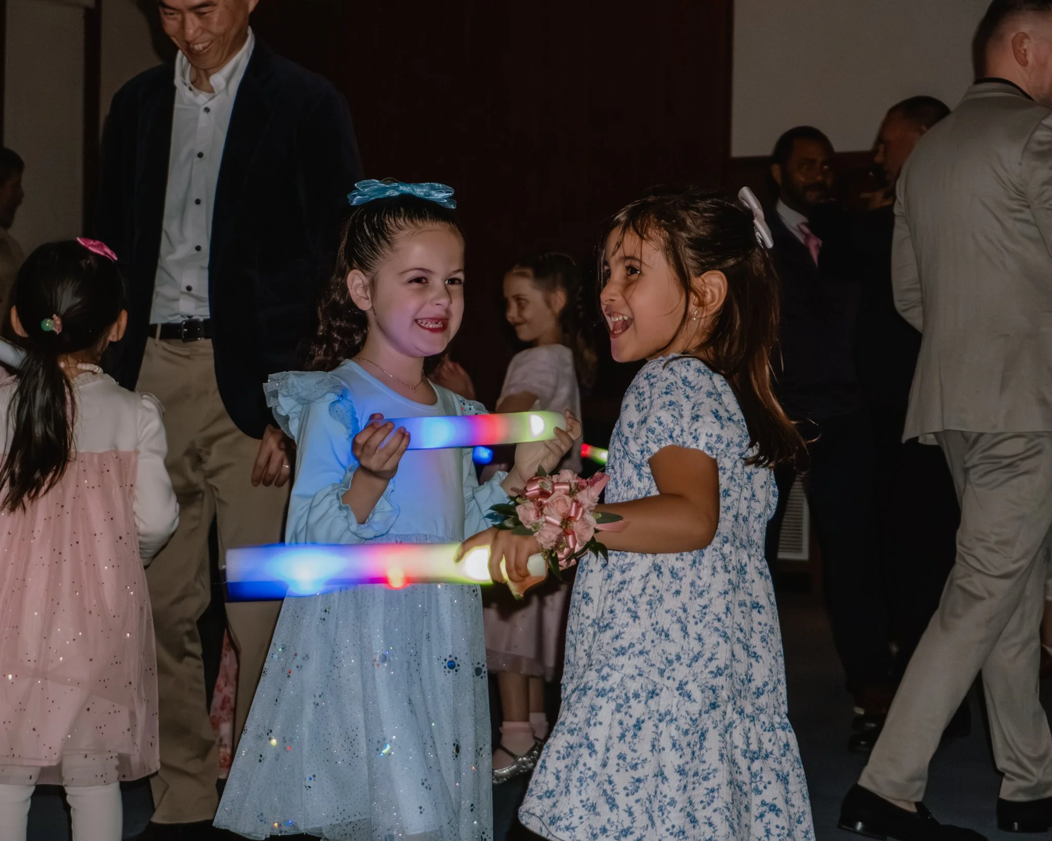 Young girls dancing with glow sticks during the Daddy Daughter Dance at Abundant Life Church in Wilmington MA.