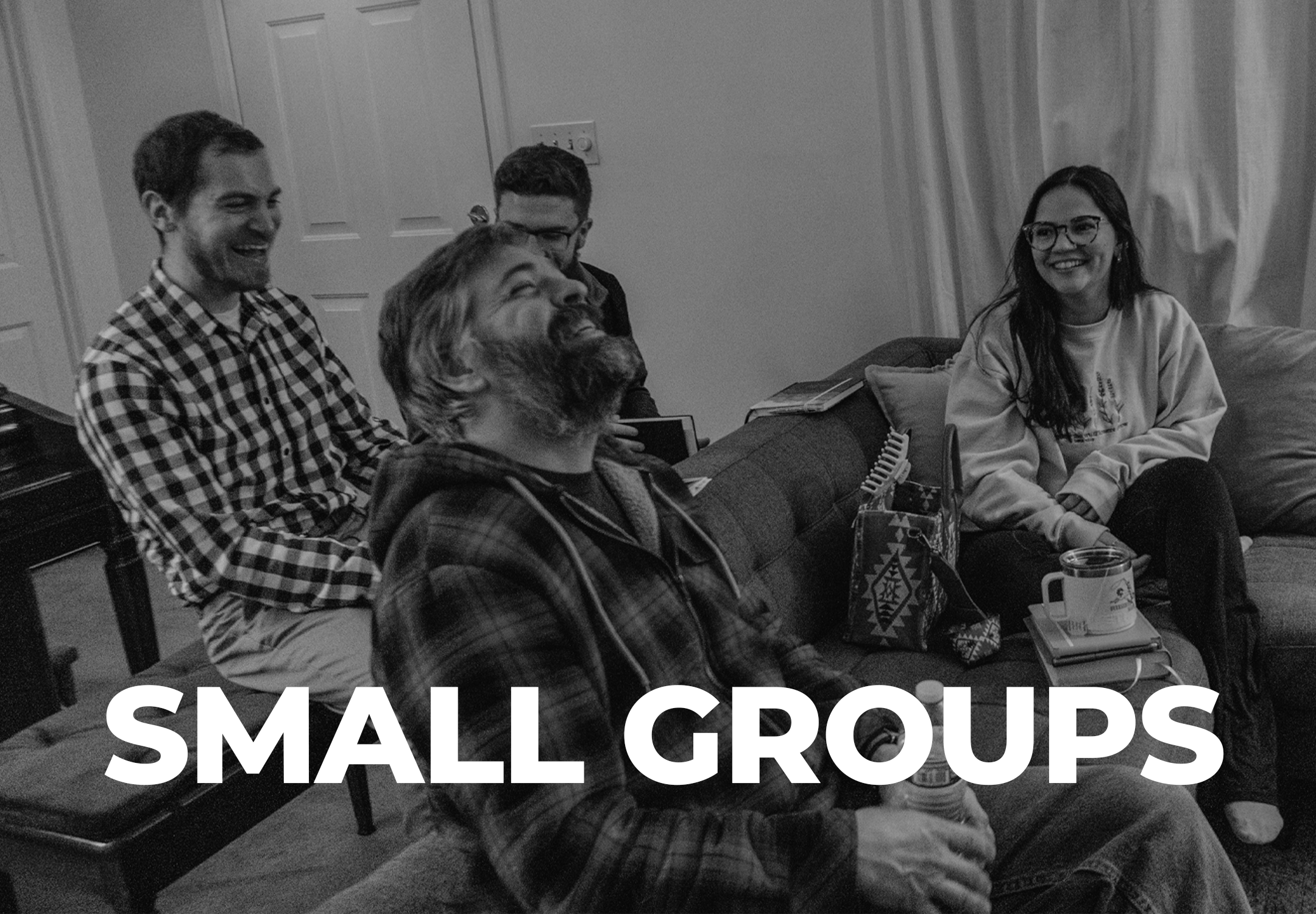 Adults from Abundant Life Church in Wilmington, MA gathered in a small group, smiling and in conversation.