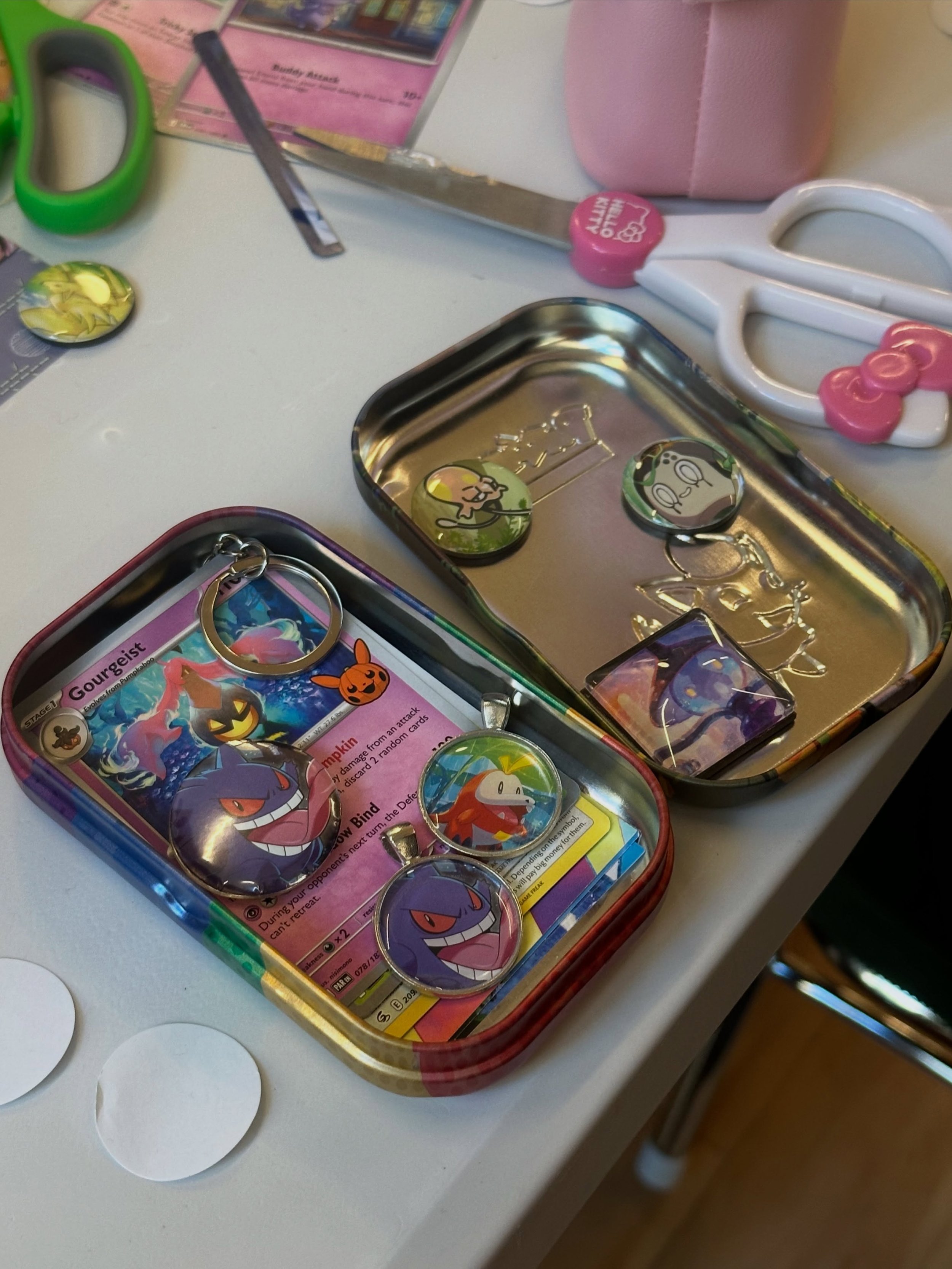 Magnets, buttons &amp; keychains made from bulk cards and origami paper.  Such a fun evening! 
I absolutely adore hosting these free craft nights at @thetrainercourt 🥹 

#nyc #pokemon #pokemoncards #trainercourt