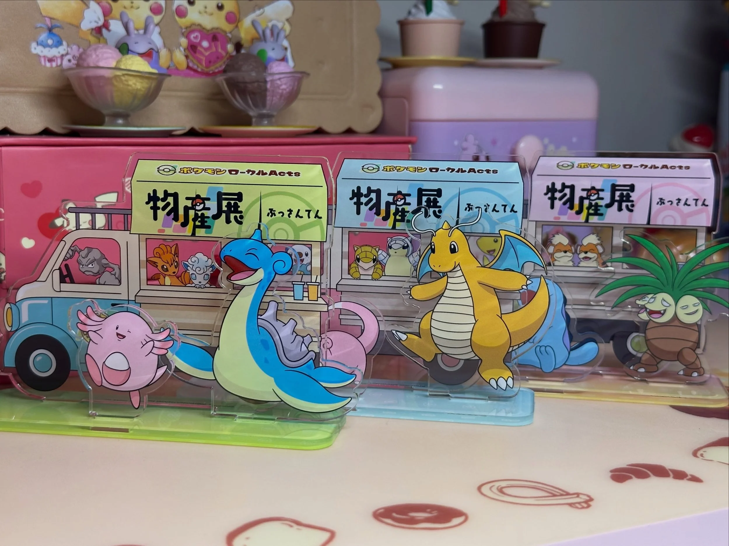 These are from the Pok&eacute;mon Local Acts Bussanten! 🌟 

Local Acts Bussanten is a touring regional specialty fair in Japan, where specific Pok&eacute;mon &amp; the prefecture that they are the mascot of showcase local goods and crafts. There are