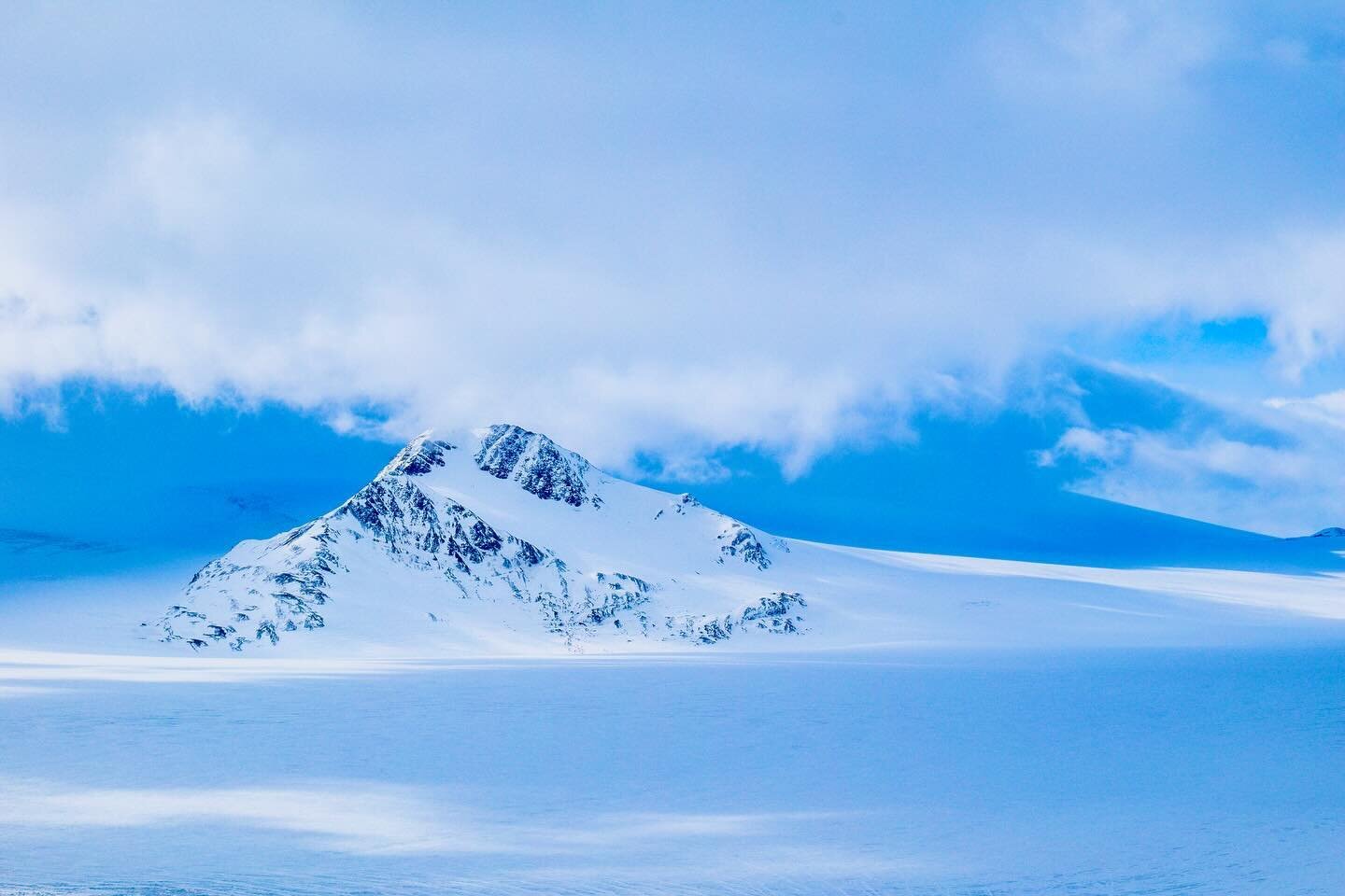 One of my favorite snowy shots, a peak poking out at the Harding Ice field at Exit Glacier in Seward, Alaska. Stay warm out there!