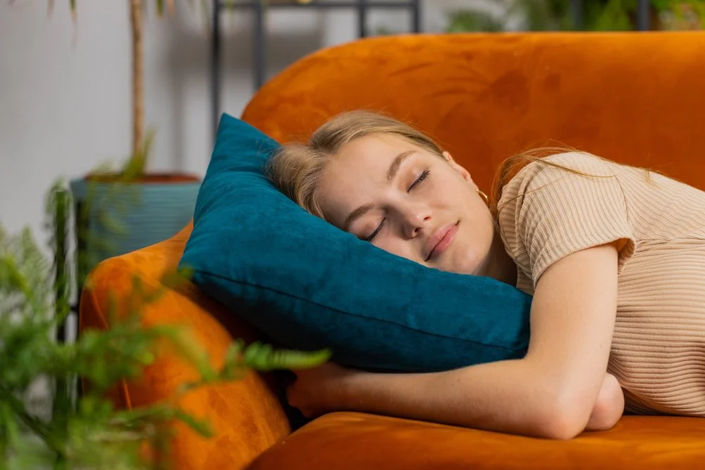 woman resting on the couch