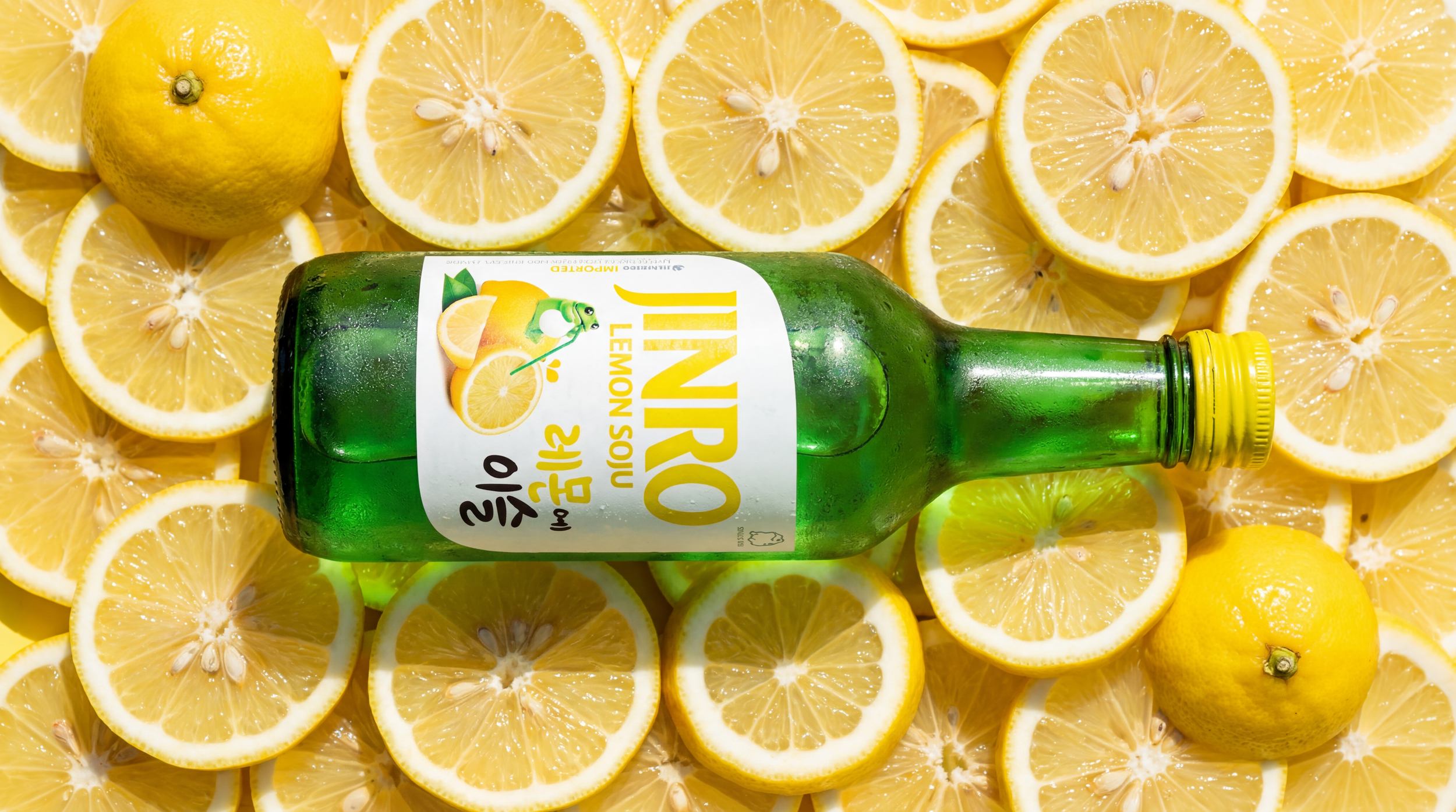 bottle_laying_on_stack_of_sliced_lemons__top_down_view__bright_vivid_lighting_1.png