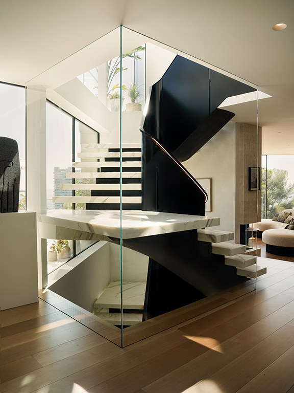  The central staircase that connects the various floors of the house is an architectural element with a strong visual impact, which combines powerful materials and streamlined lines.    Elizabeth Carababas   