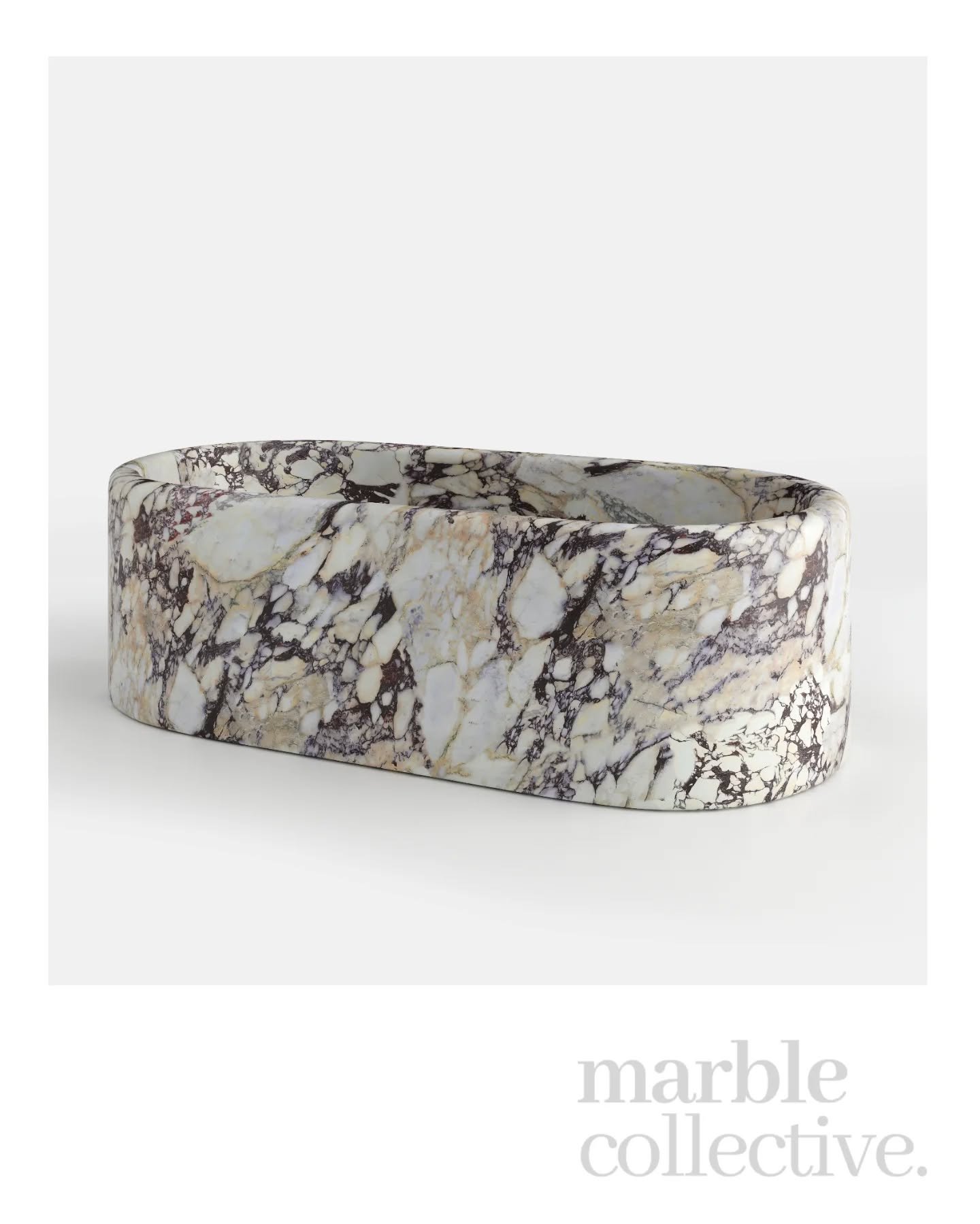 The Caspian in Calacatta Viola.

A sculptural, freestanding bath carved entirely from marble bold, weighty, and full of movement. This piece is all about presence, with sweeping curves and dramatic veining that make it the centre of the room without 
