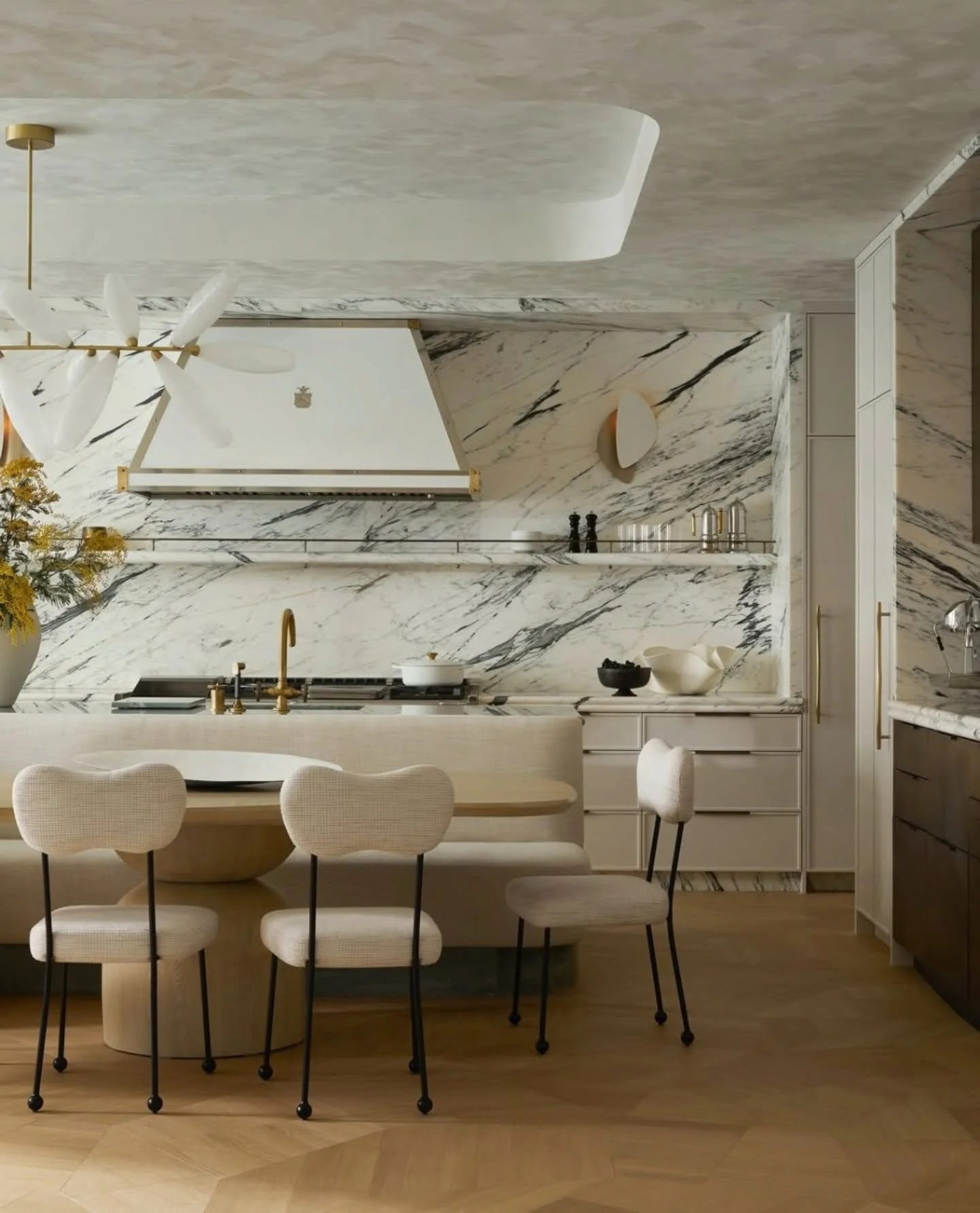 Our thoughts on this space?

It feels resolved rather than decorated as the marble is not being used as a statement piece sitting within the room, it becomes the room. The way the veining travels across the walls and splashback gives a sense of conti