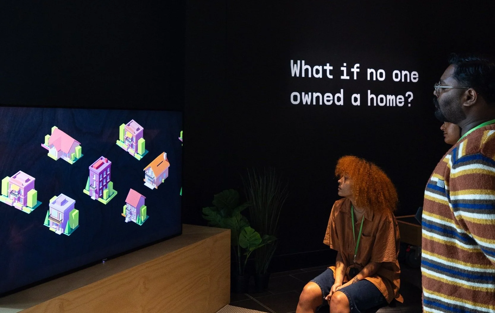 group of people watching a video on screen