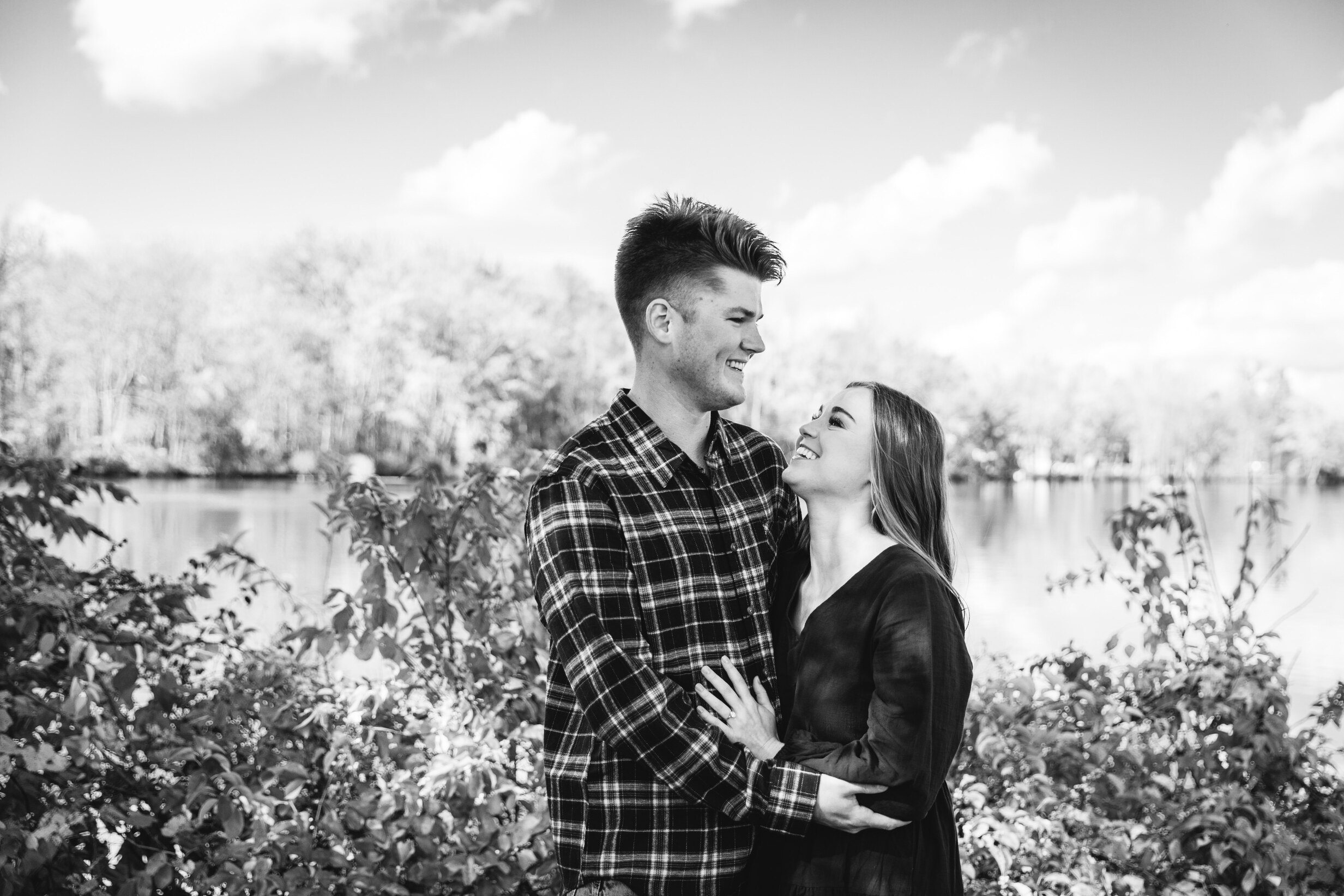  engaged couple laugh during a session with a central ny photographer 