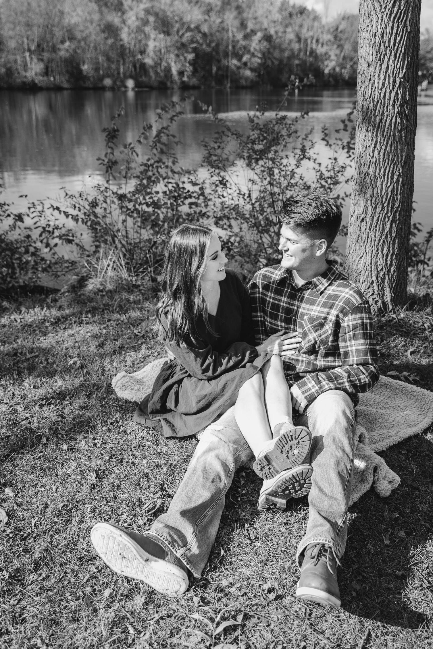  engaged couple laugh together during their fall engagement photos 