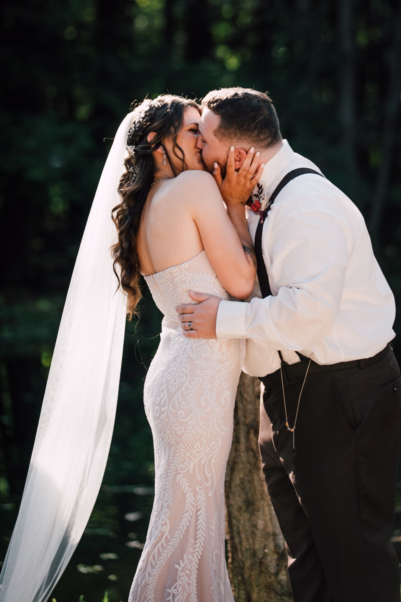  The bride and groom share their first kiss at their outdoor fall wedding 