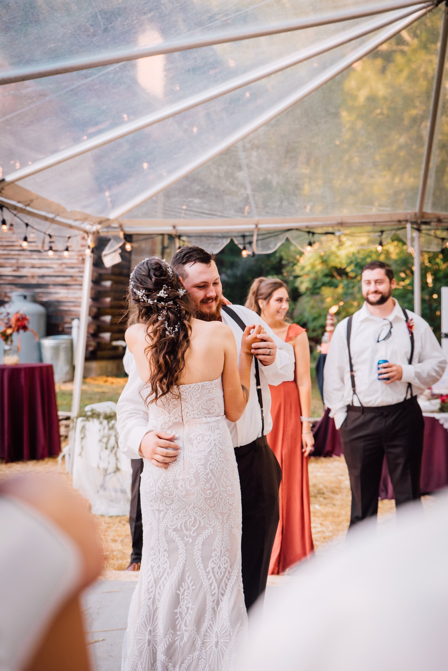  The bride and groom share their first dance at their outdoor fall wedding 