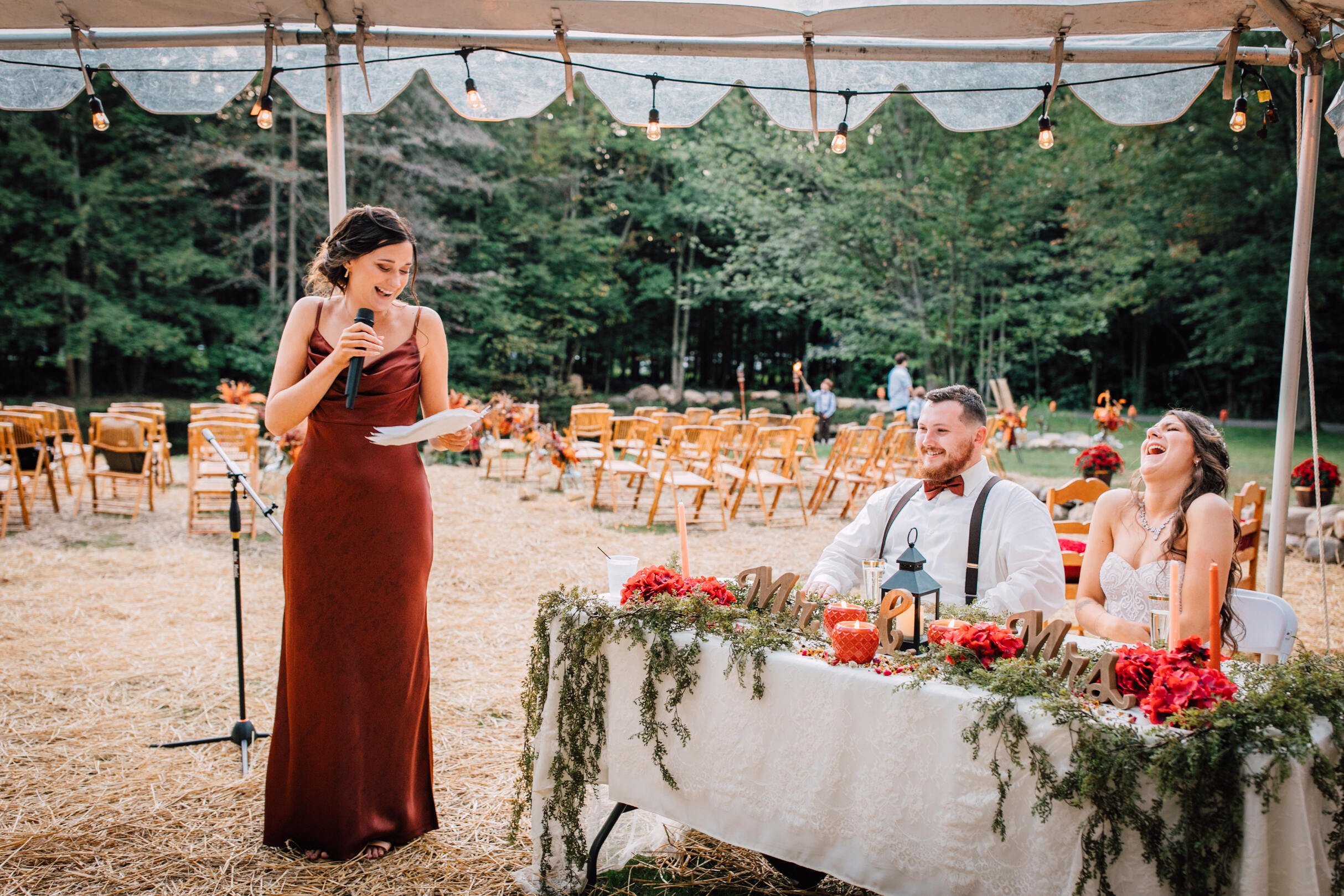  The maid of honor gives at toast at a backyard wedding 