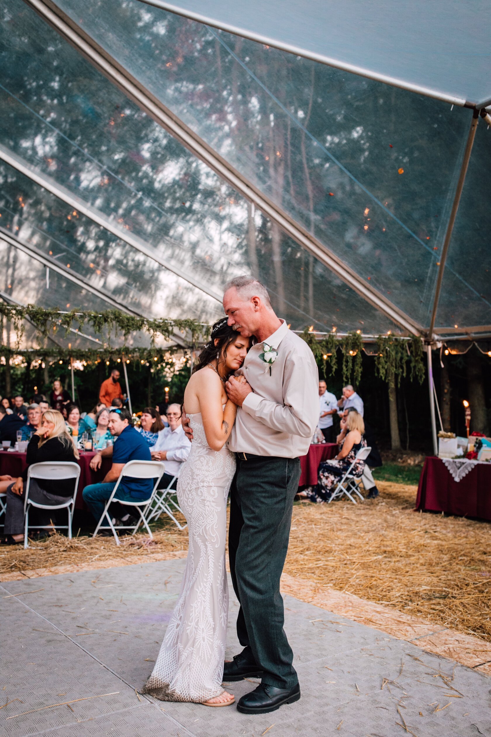  The bride dances with her father at her rustic wedding 