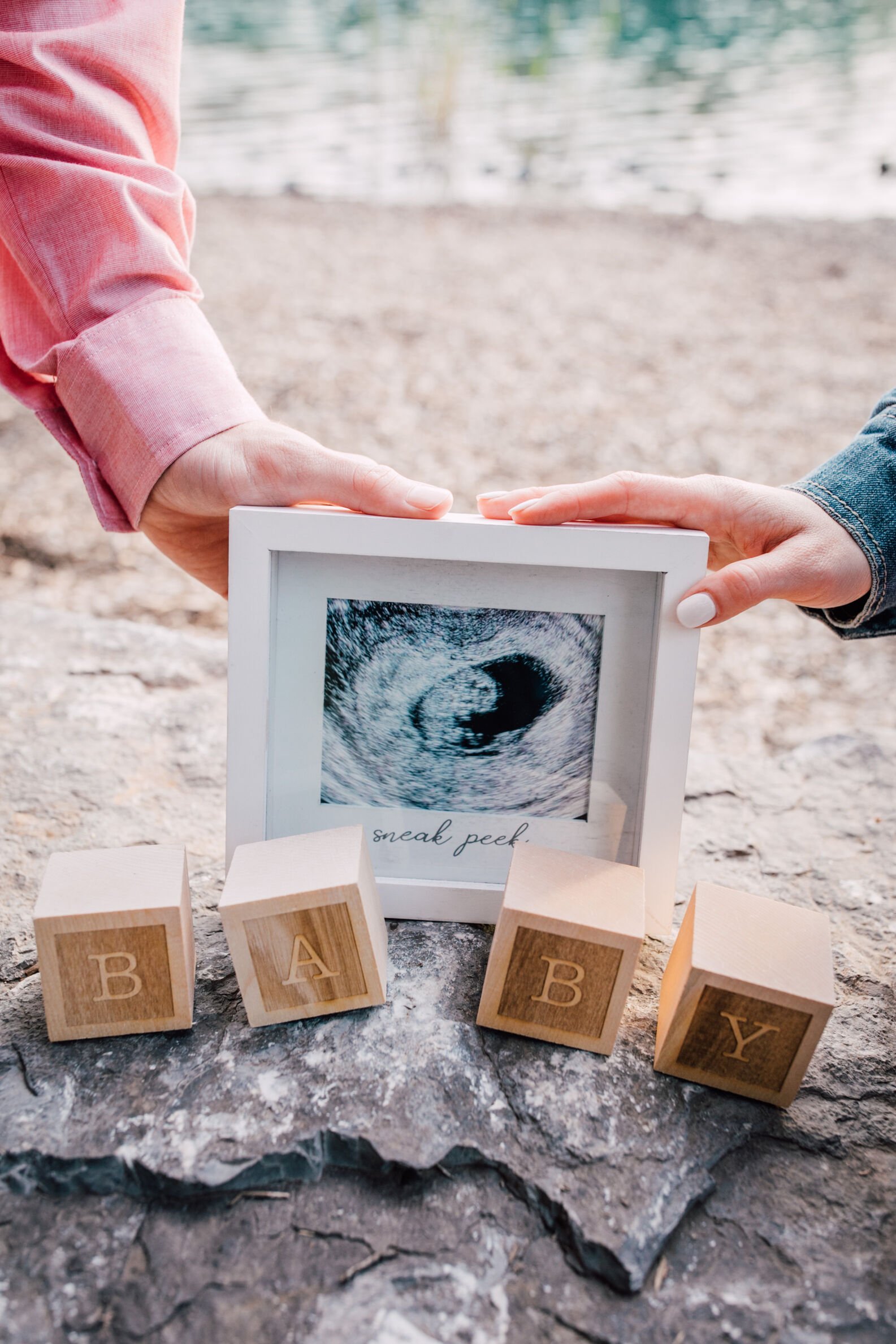  Parents to be hold ultrasound photo at pregnancy announcement photo shoot&nbsp; 