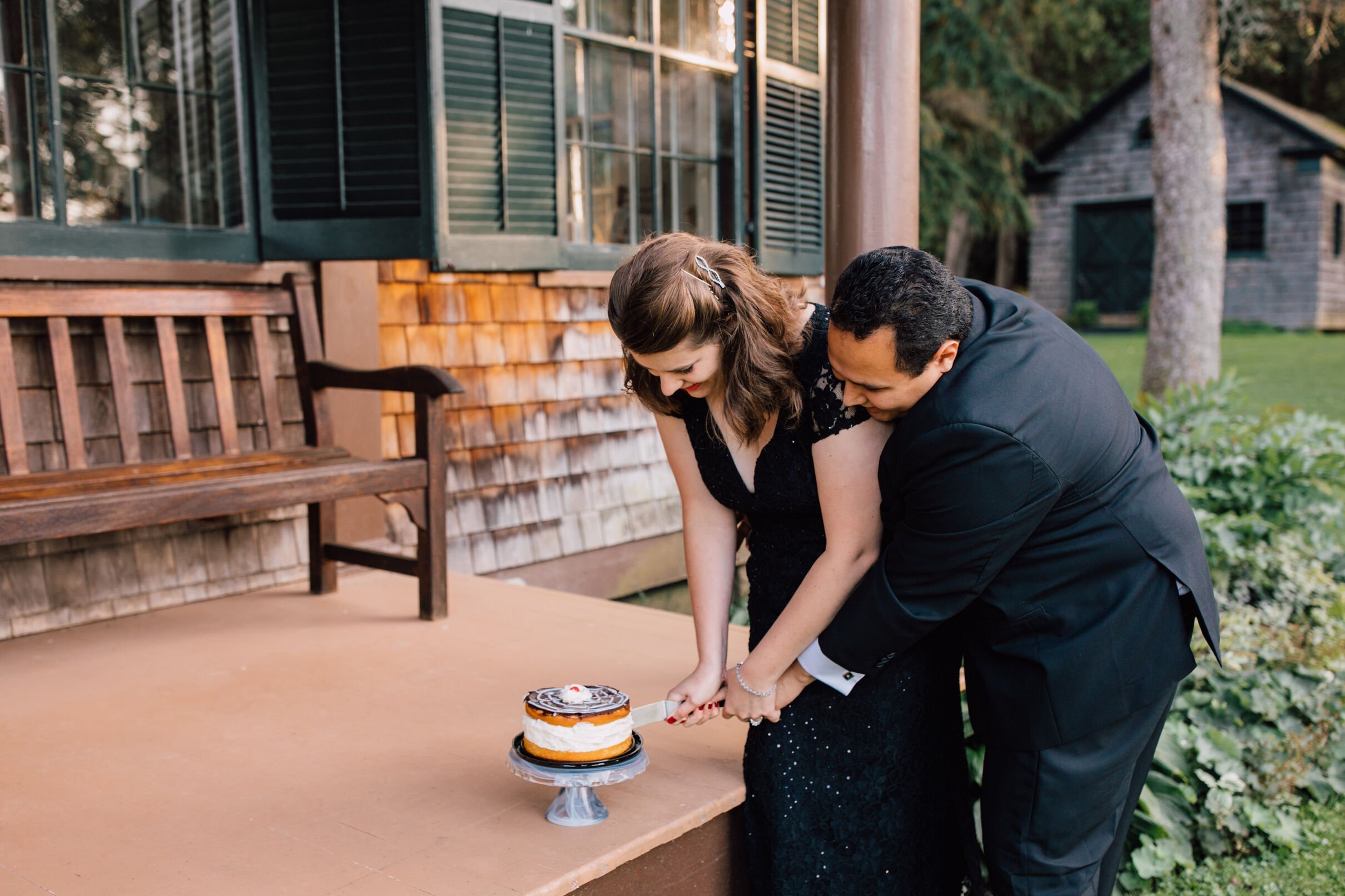  A married couple cut a cake together on their first anniversary making for a sweet adult cake smash 