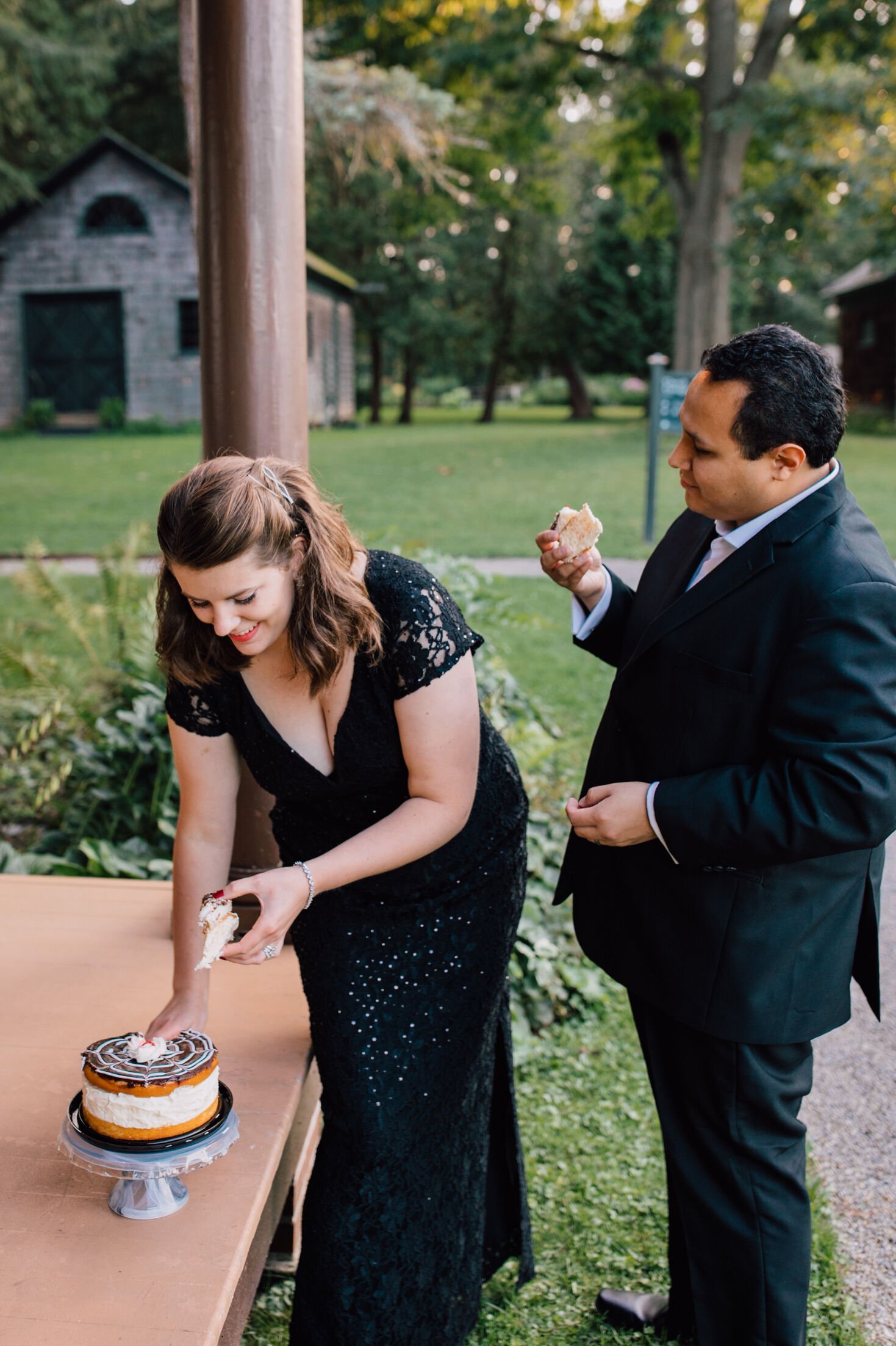  Married couple hold slices of cake during their first anniversary adult cake smash 