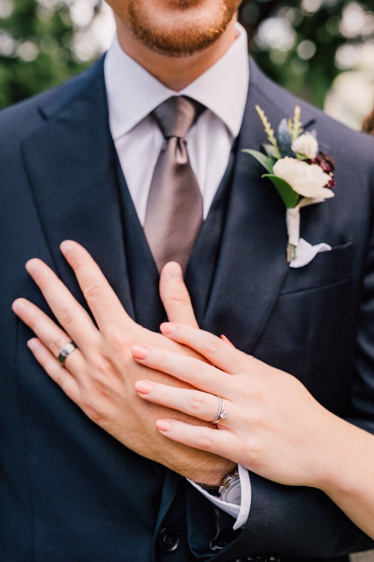  Bride and groom show off their wedding rings at their outdoor wedding ny 