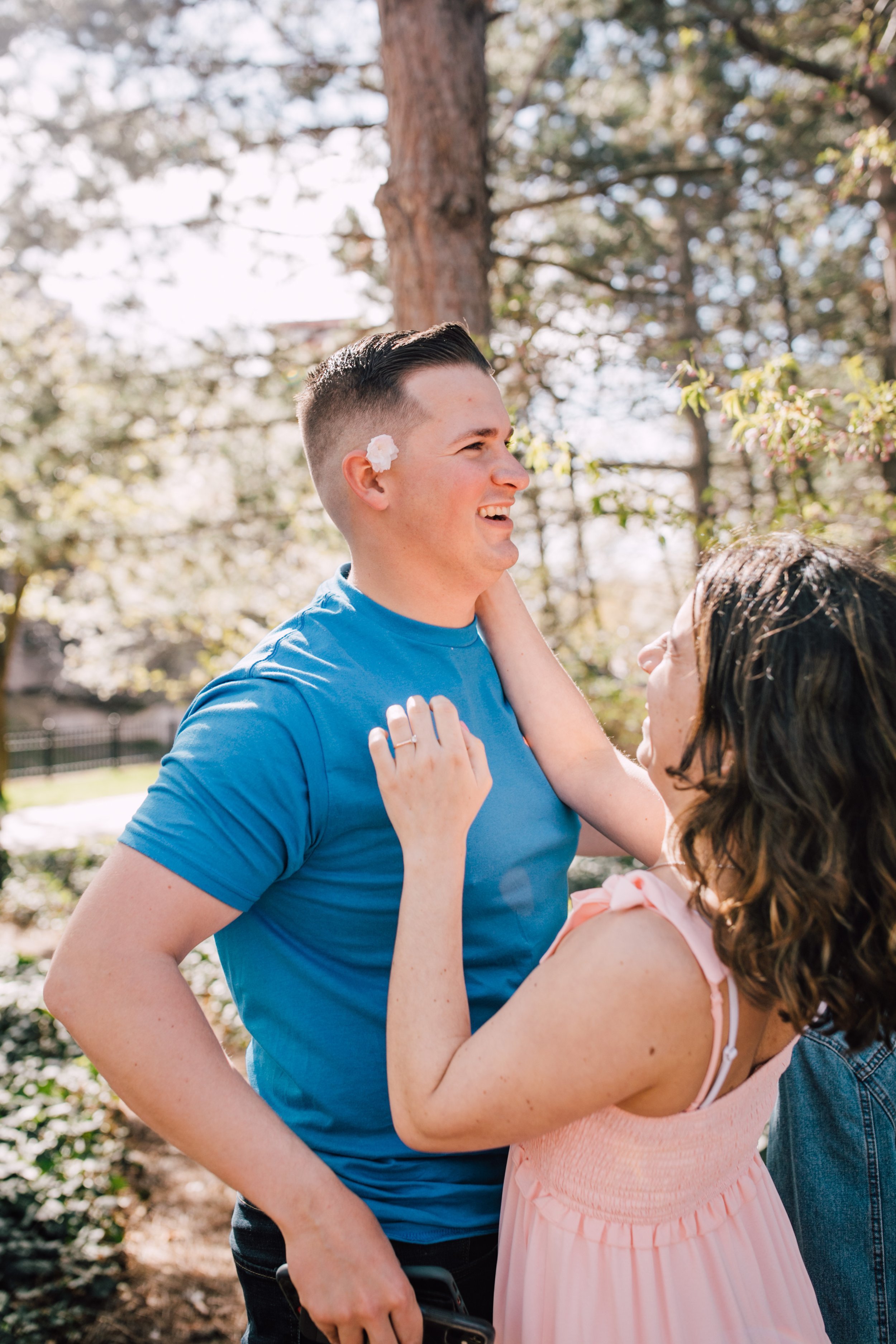  engaged couple laugh together during engagement photography 
