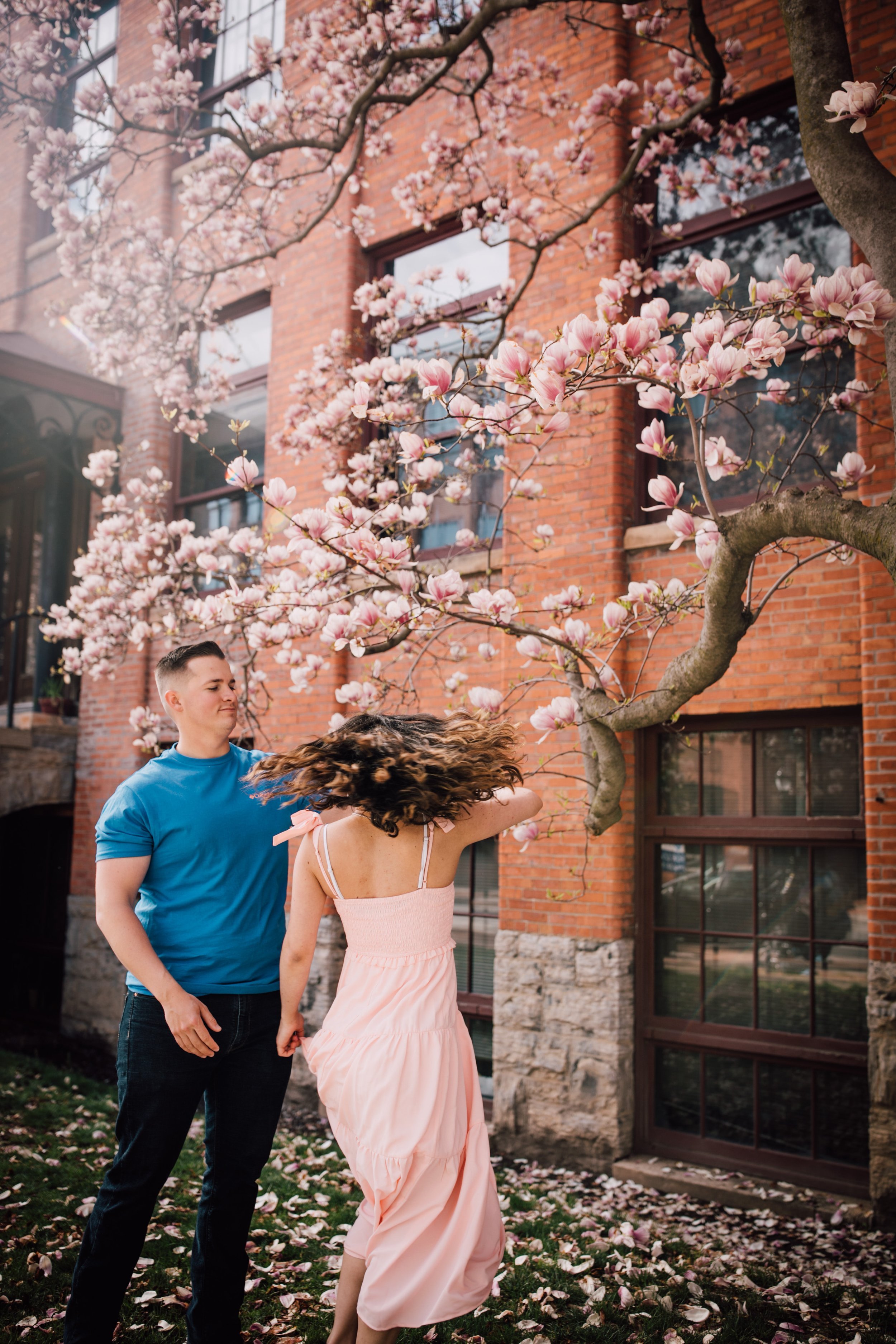  engaged couple dance during engagement photography 