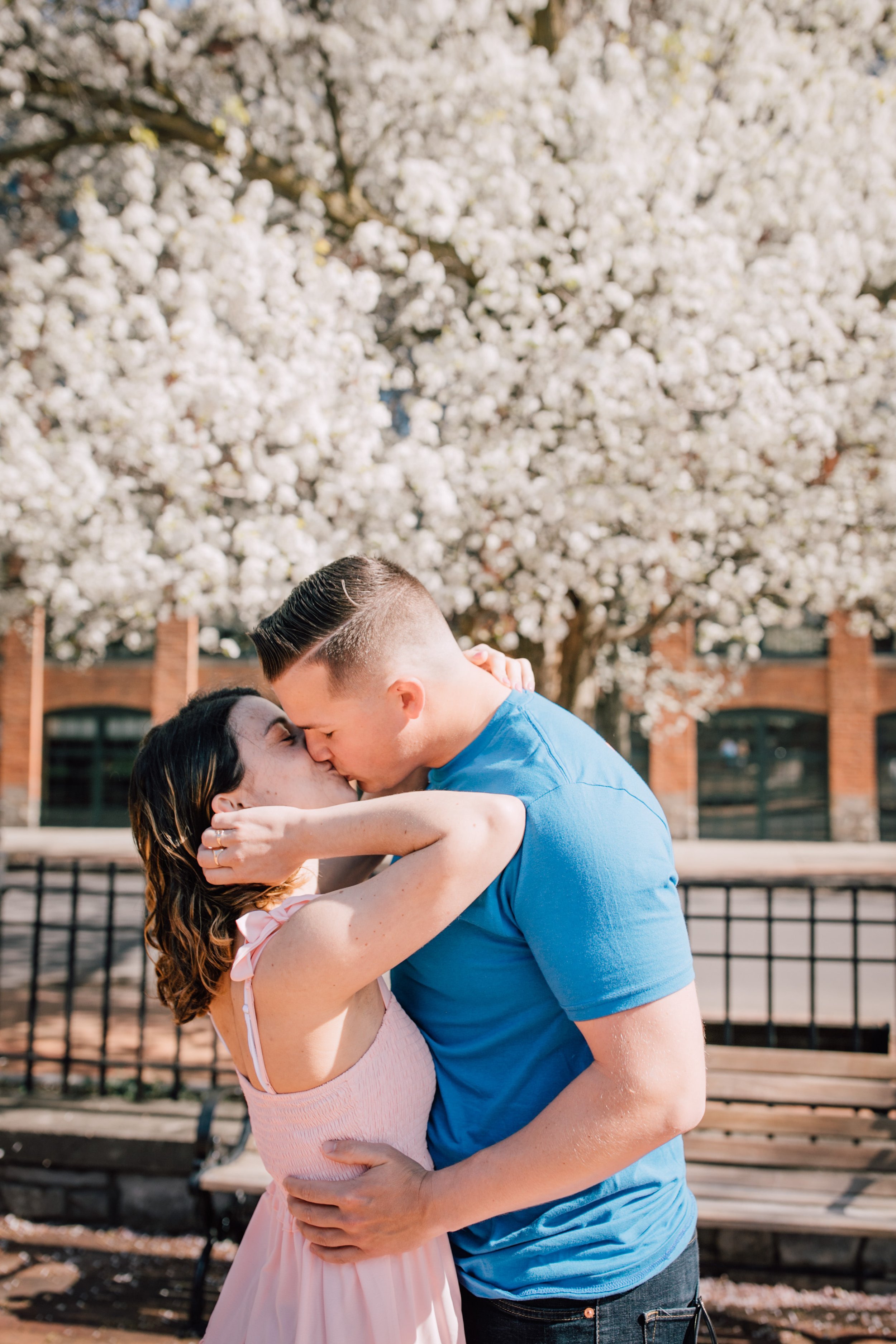  engaged couple kiss in downtown syracuse 