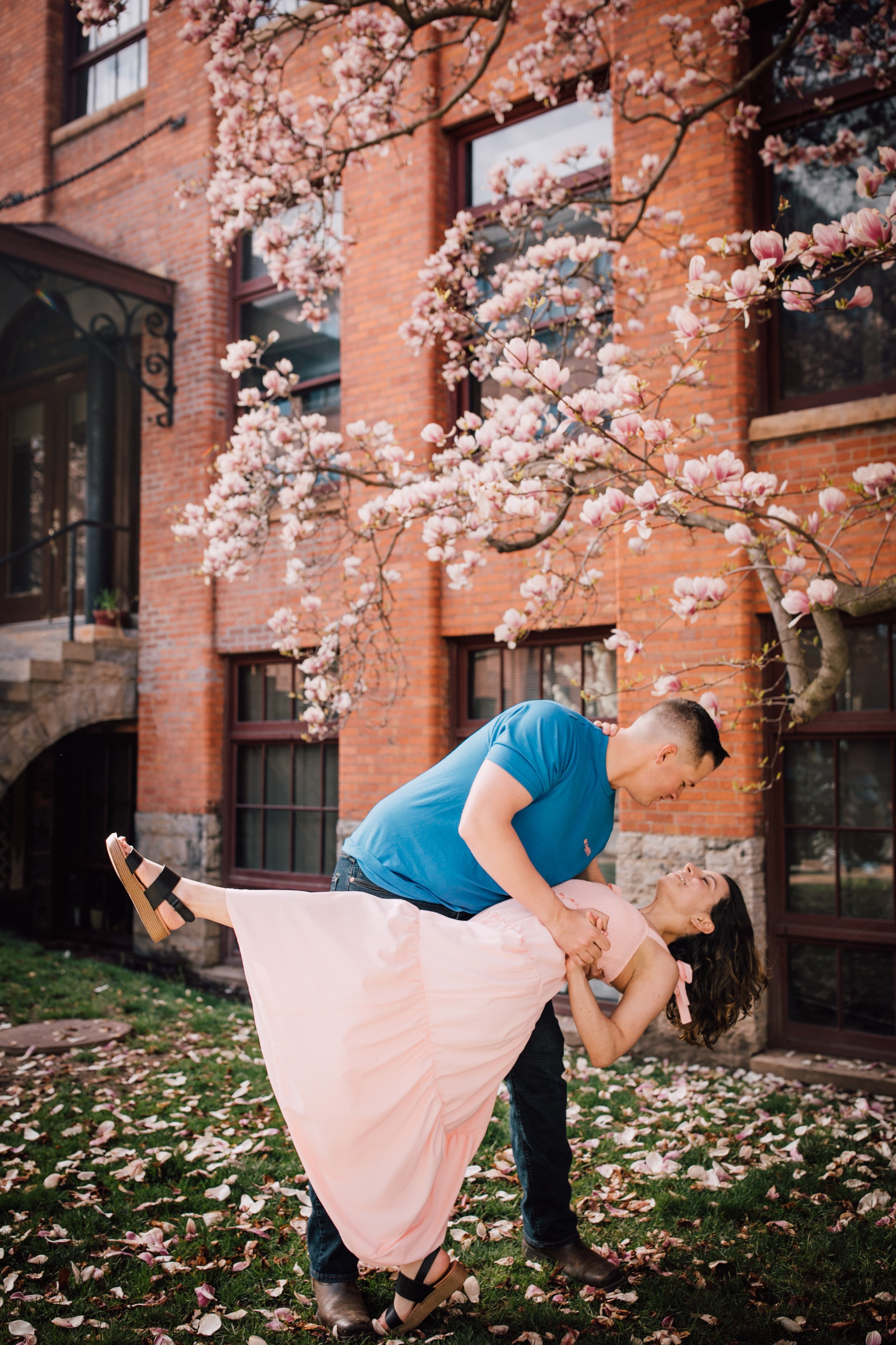  engaged coouple dip while dancing in an engagement session in syracuse ny 