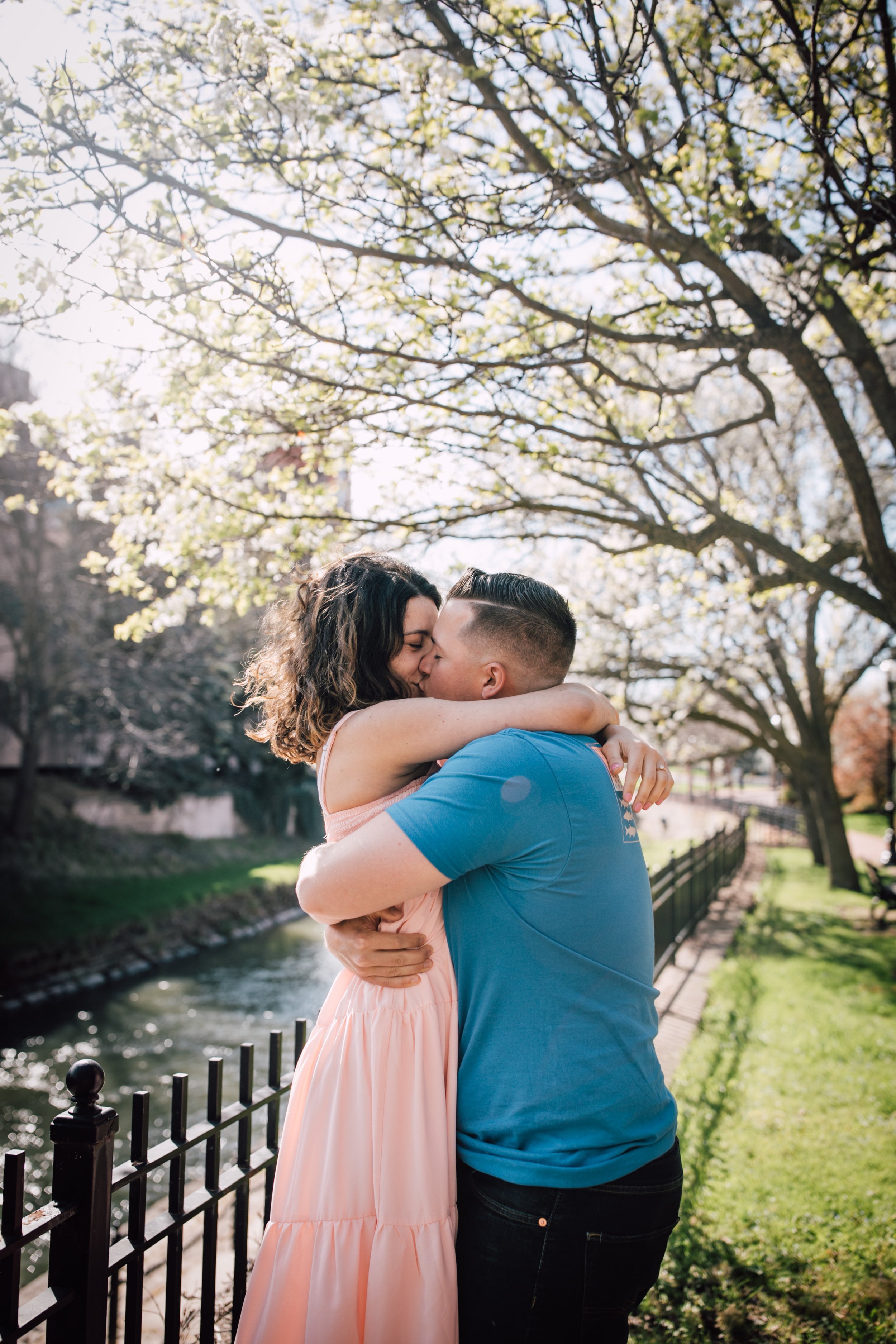  engaged couple kiss during engagement session with syracuse ny photographer 