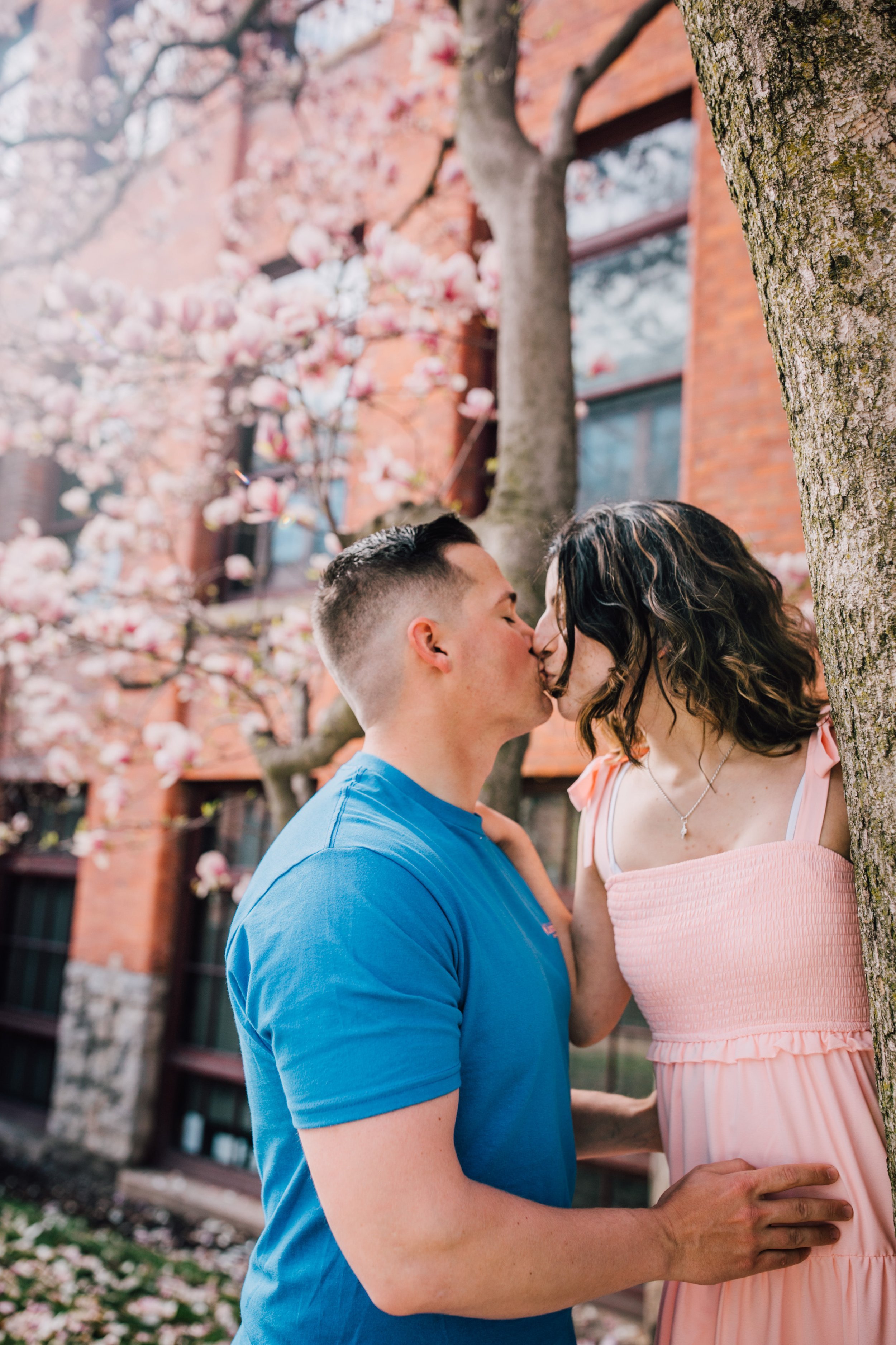  engaged couple kiss during engagement photography 