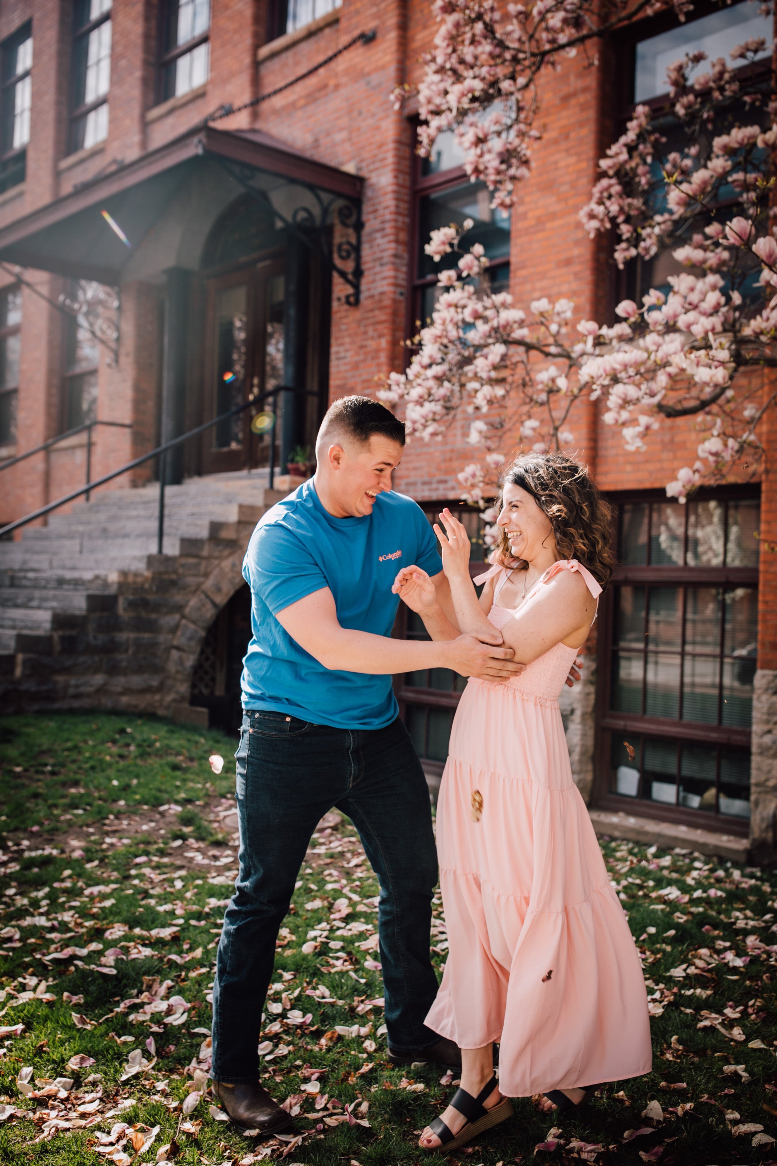  engaged couple touch during a photoshoot in downtown syracuse ny 