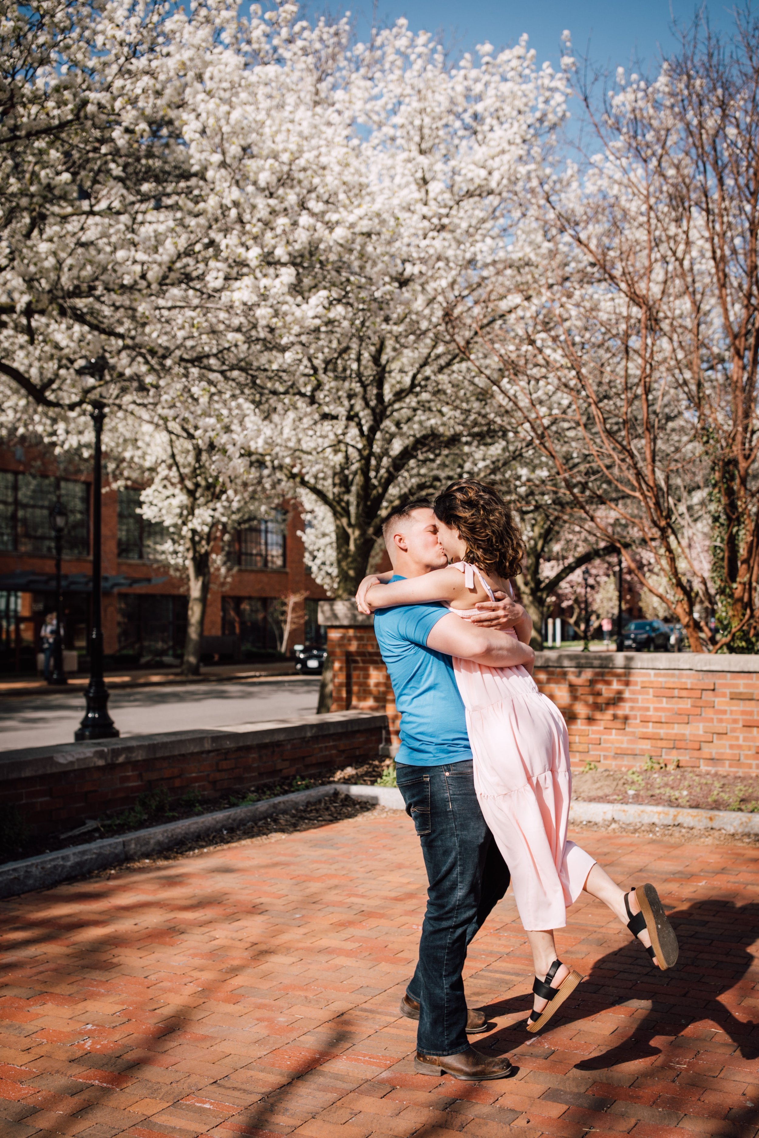  engaged couple embrace in an engagement session with syracuse ny photographer 