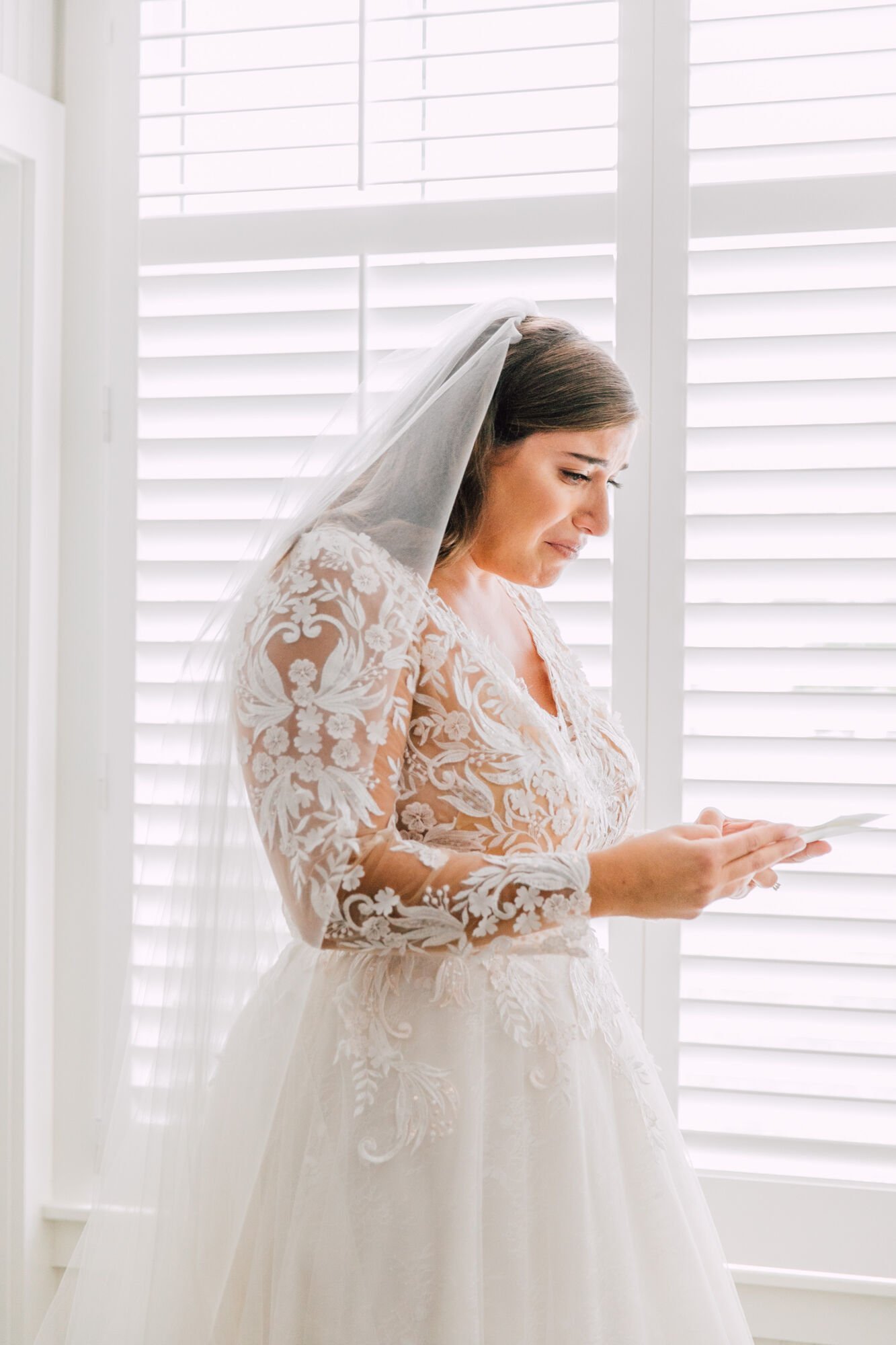  Bride reads letter from groom before their upstate ny wedding 