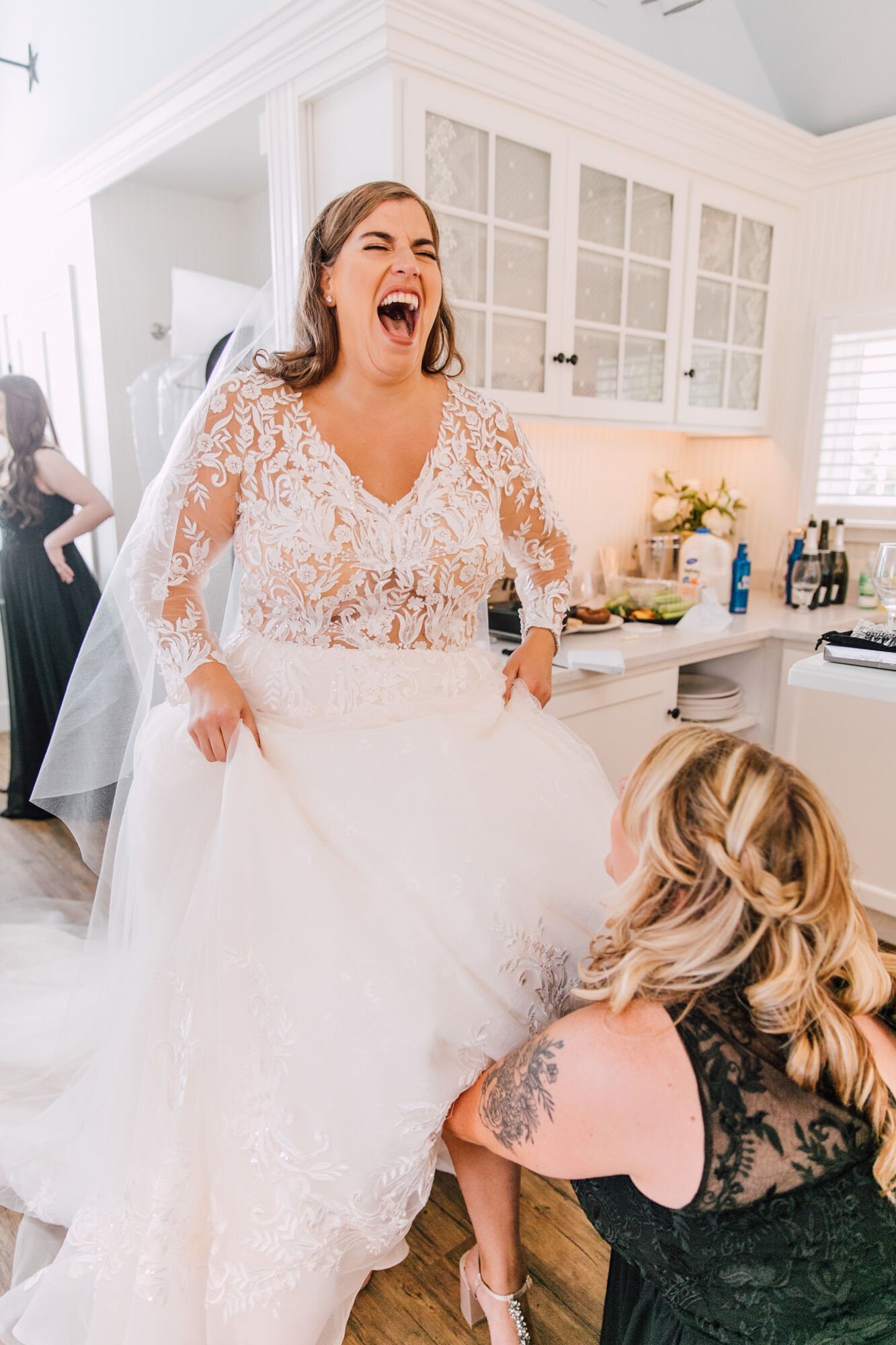  Bride laughs while getting ready for her inns of aurora wedding 