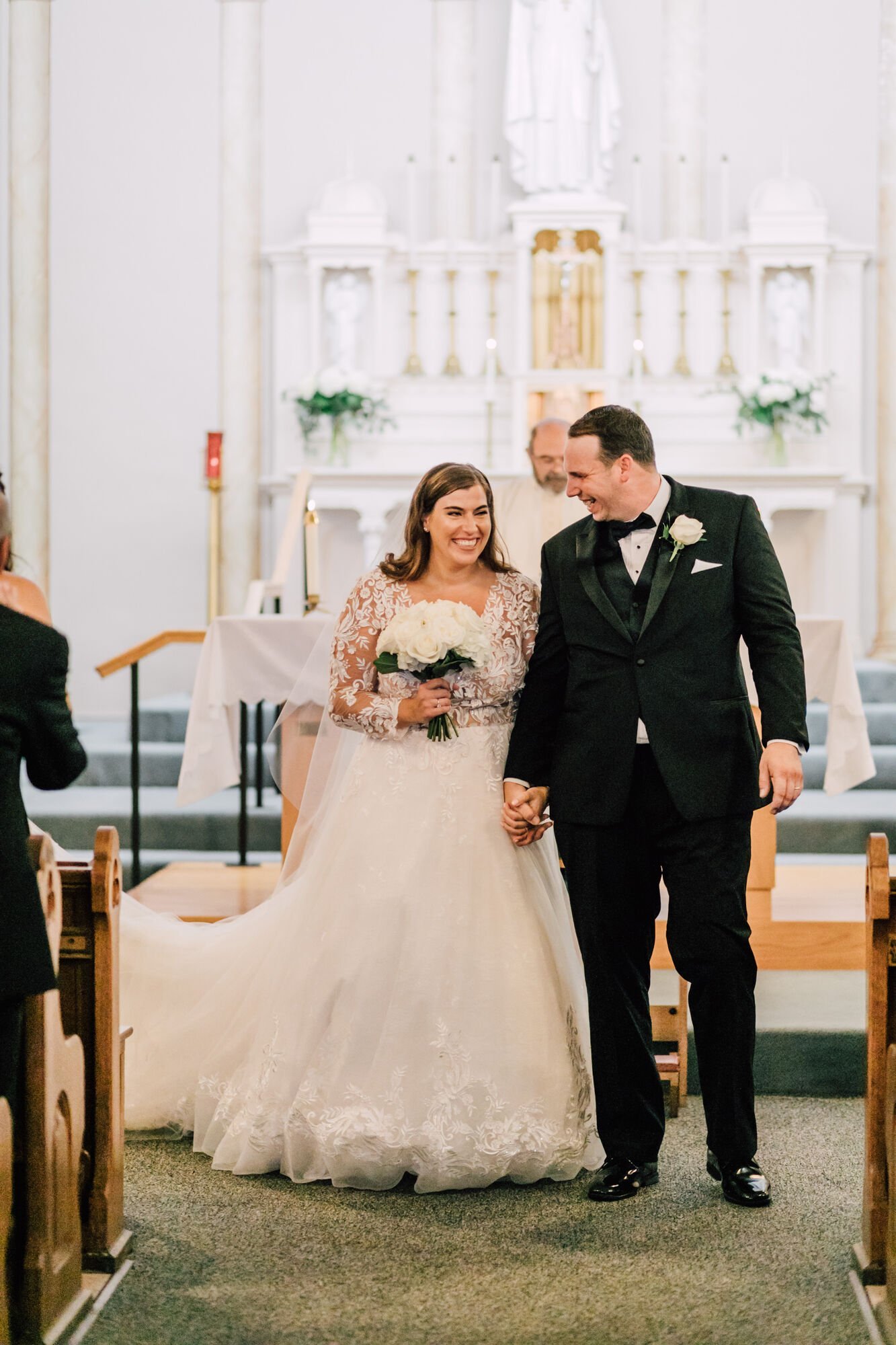  Bride and groom smile at the end of their ceremony in upstate ny wedding 