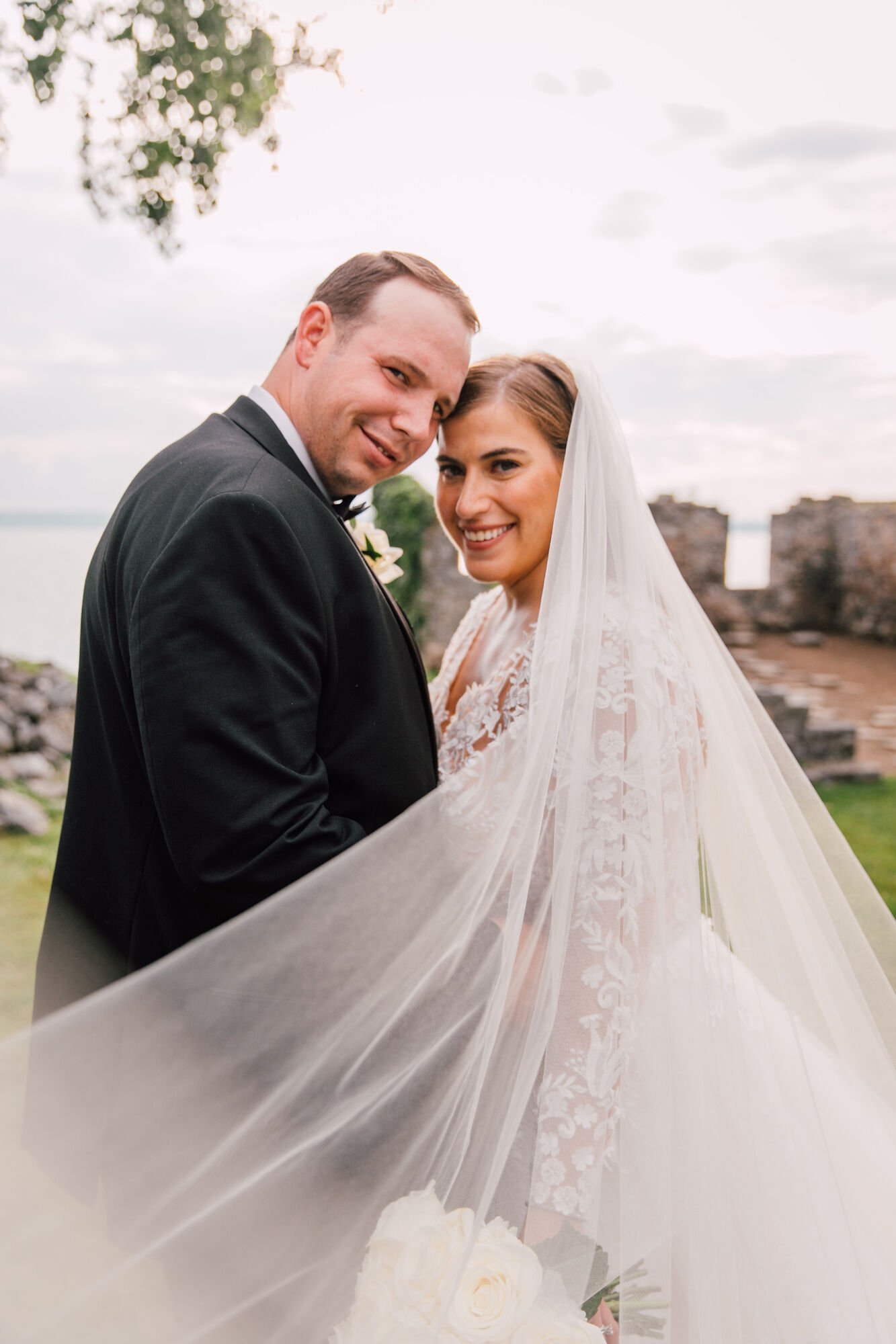 Bride and groom smile at their finger lakes wedding photographer 